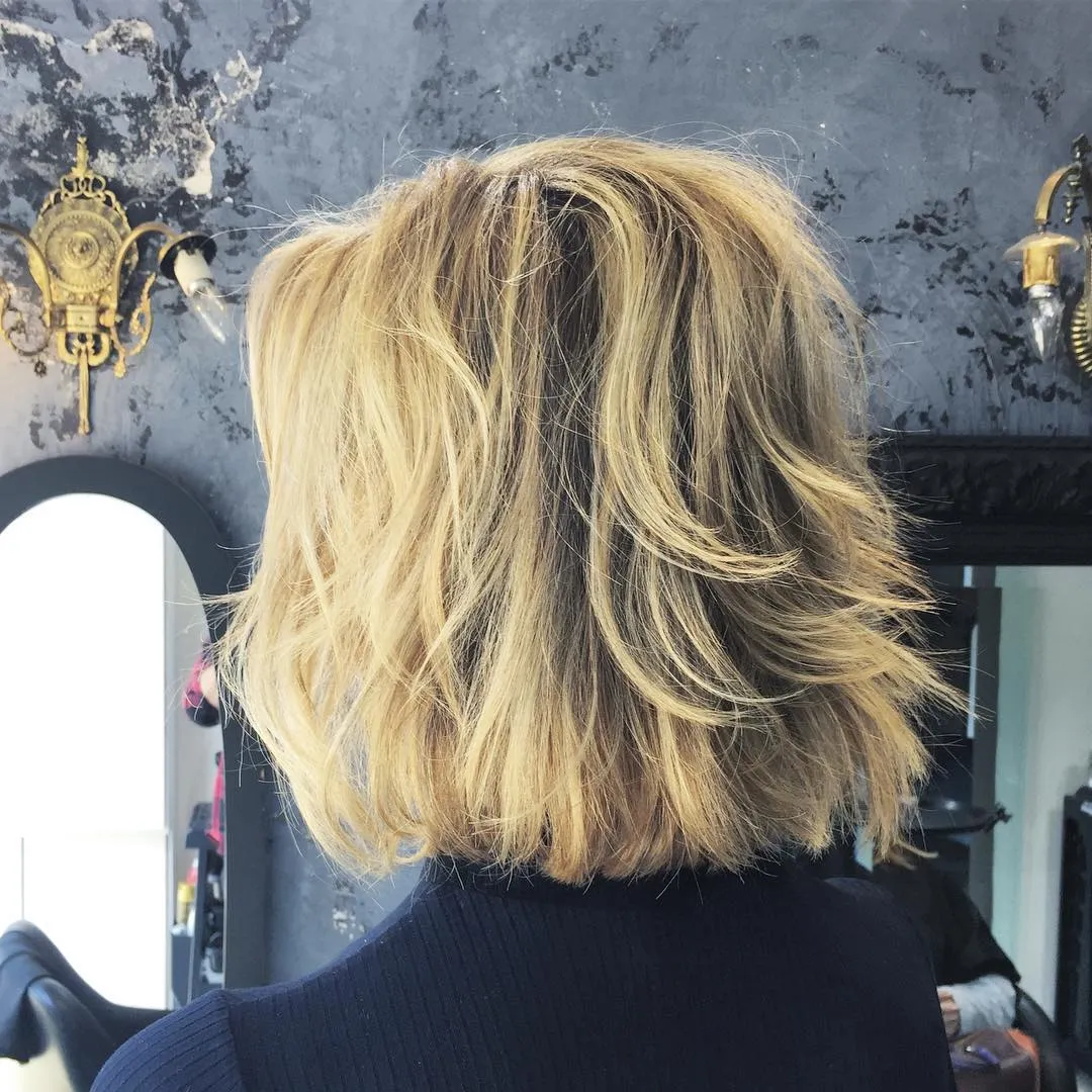 Layered midi bob with feathered flipped ends