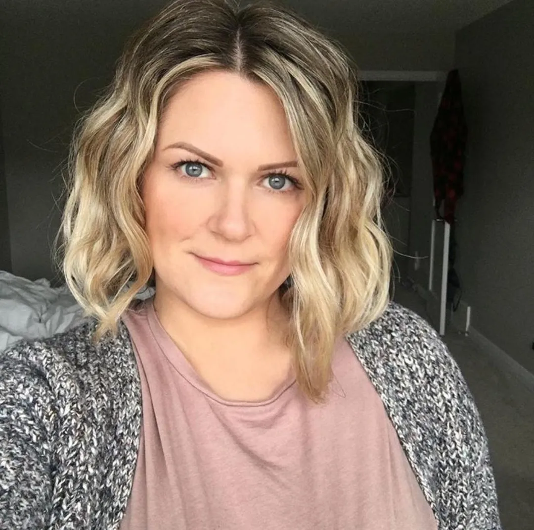 Loose wavy midi bob with a centre part