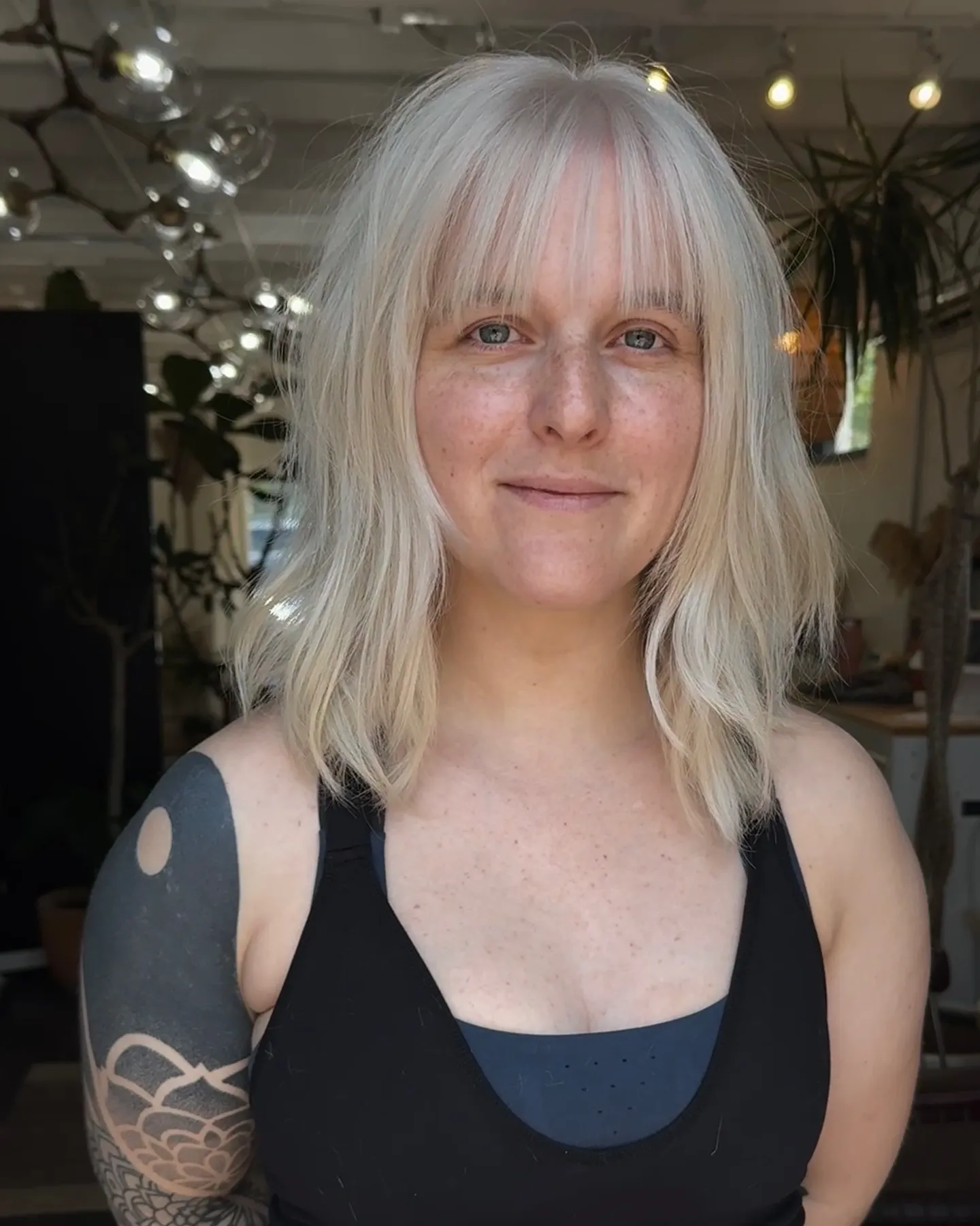 Light blonde midi bob with wispy full fringe