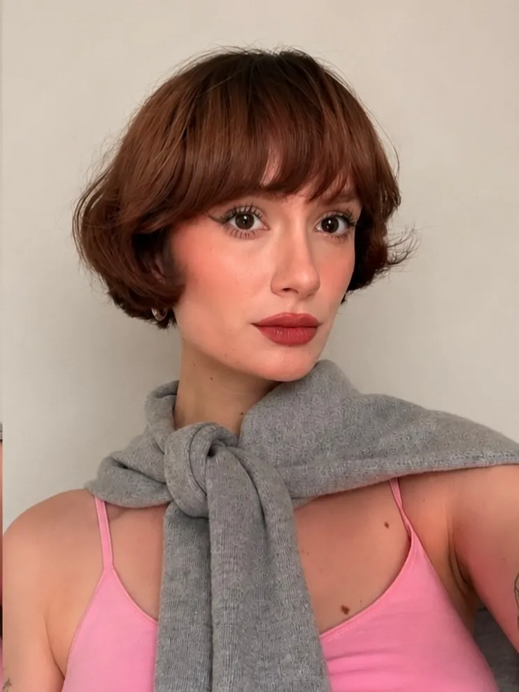 Rounded mini bob with curved fringe and flicked ends