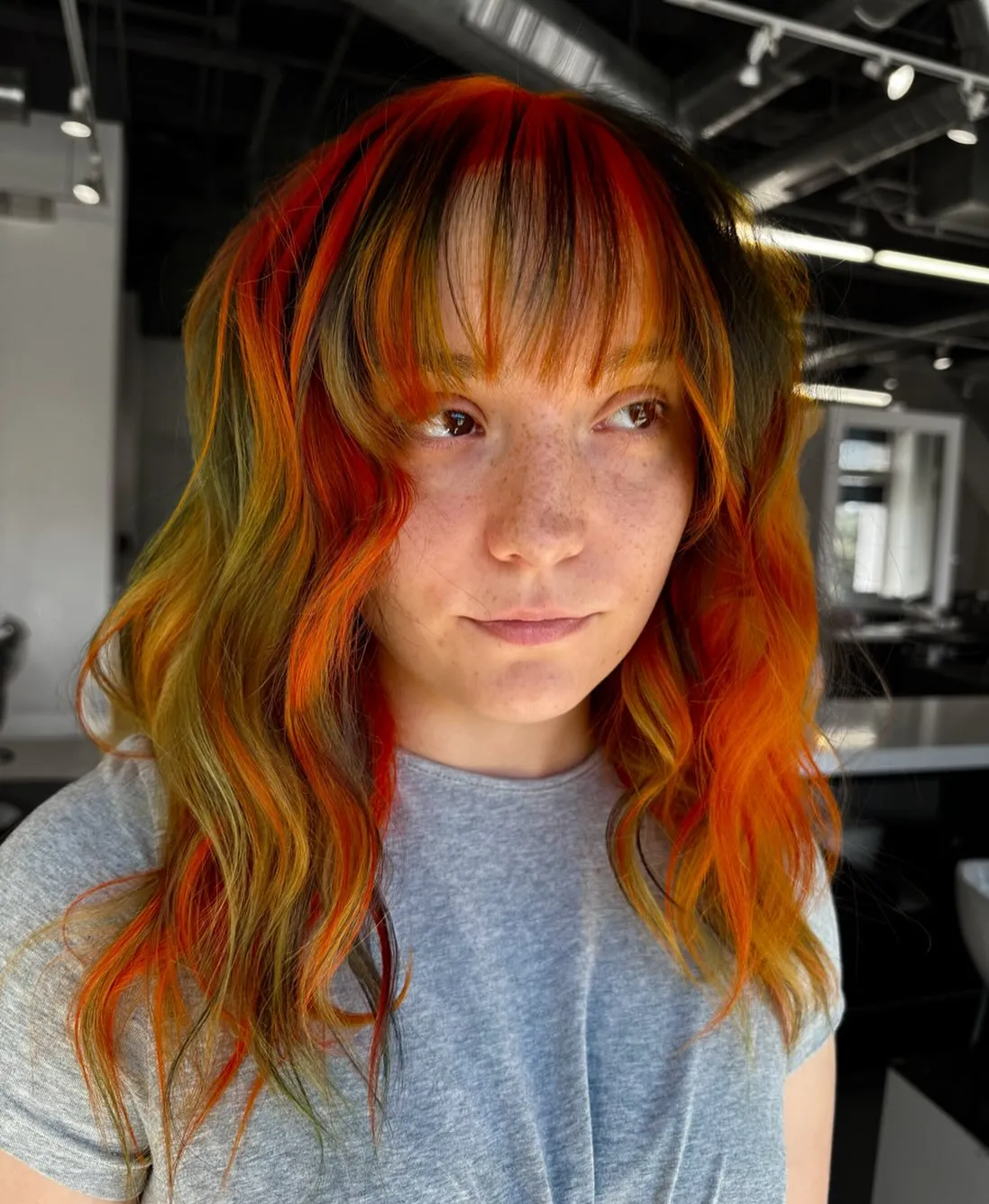 Long shag with full bangs and red, orange and yellow colour panels