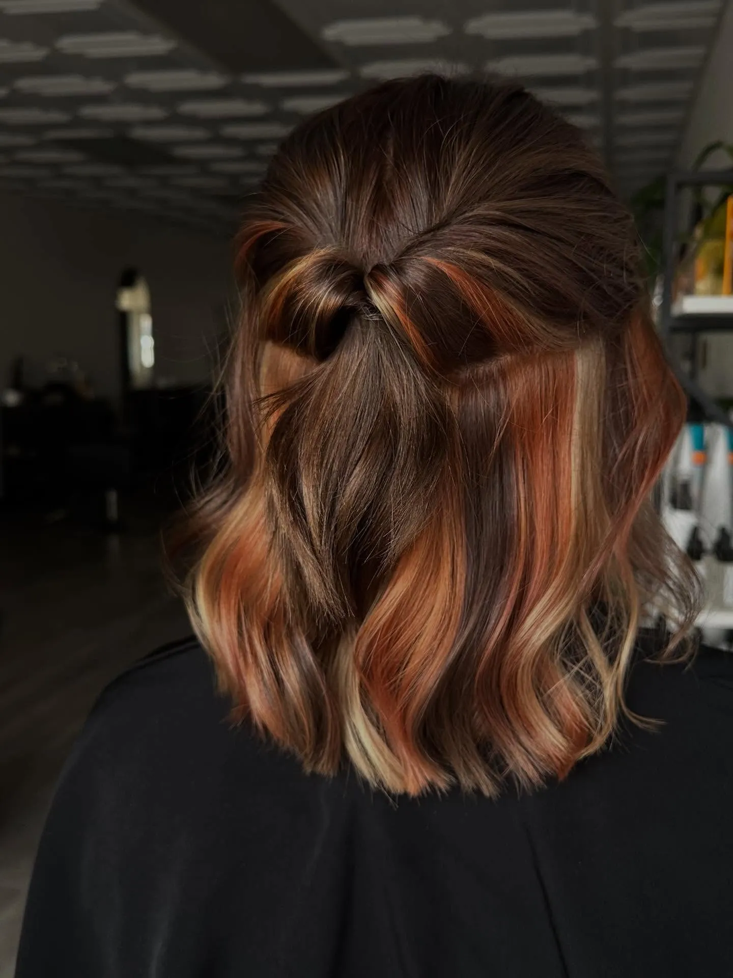 Wavy lob with half-up ponytail and warm copper, blonde and brunette ribbons