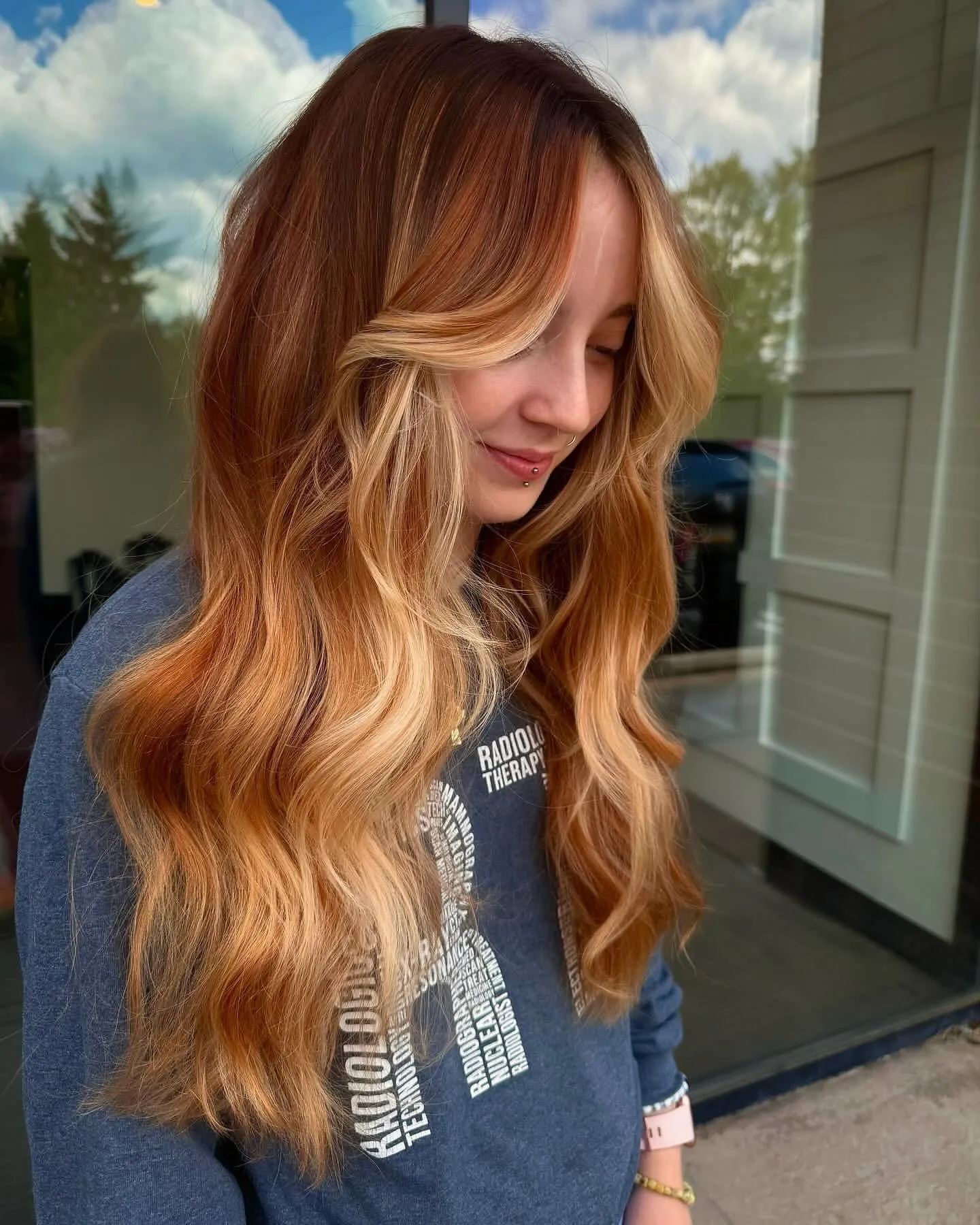 Long copper waves with lighter face-framing pieces