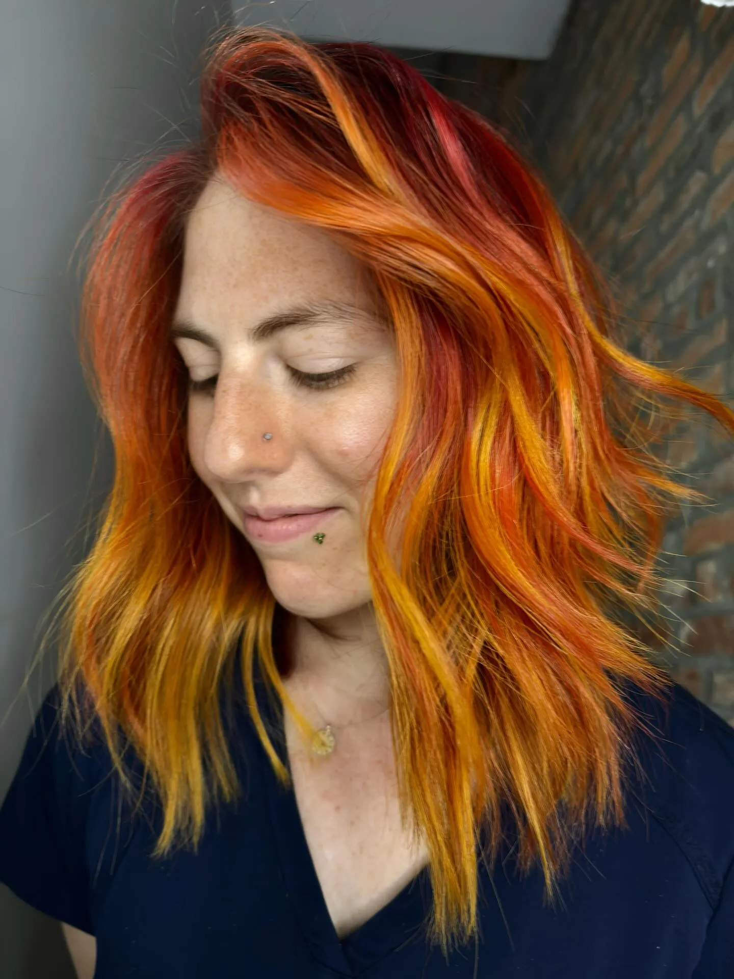 Textured shoulder-length lob with vivid orange, red and yellow tones