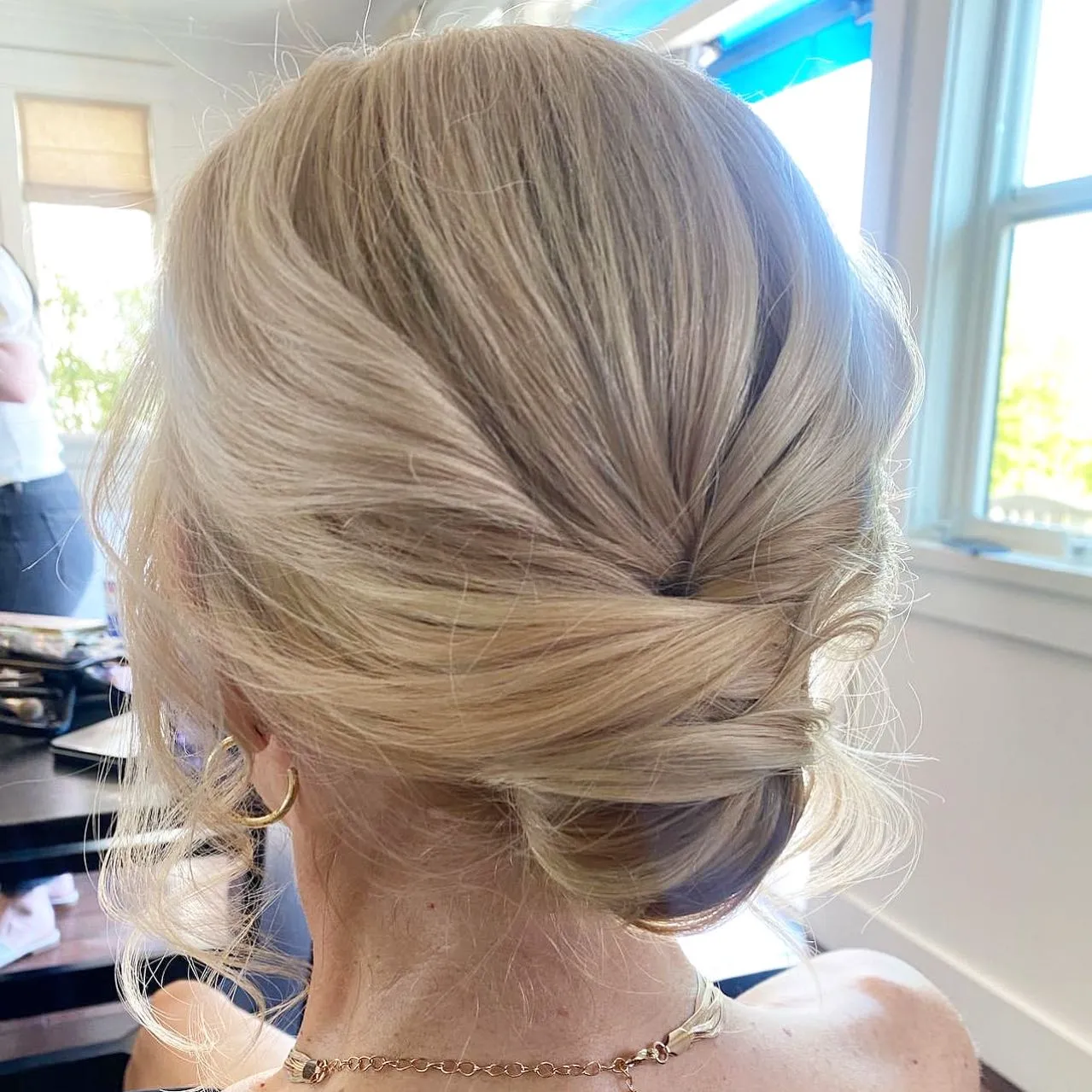 Smooth wrapped low chignon on blonde hair