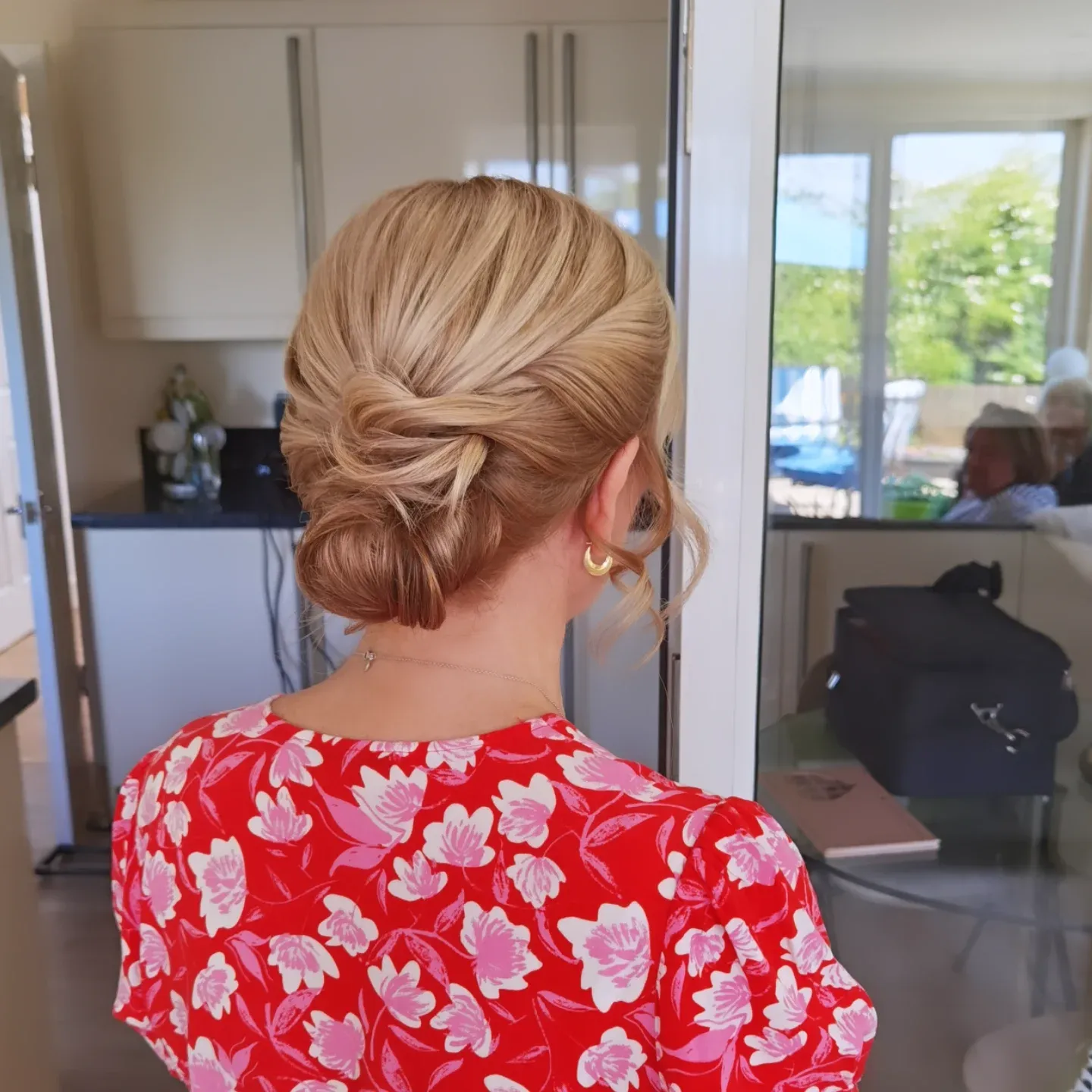 Smooth low chignon on strawberry blonde hair