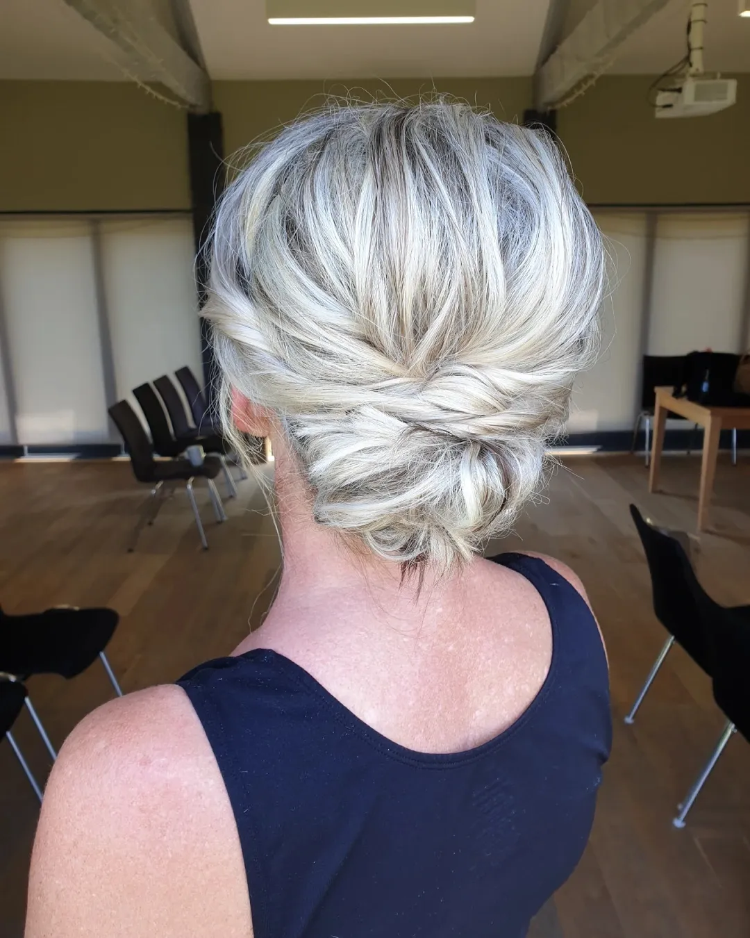 Twisted low bun on silver blonde hair