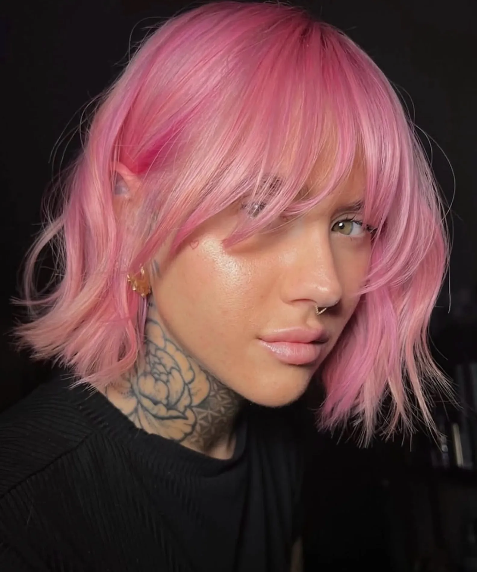 Pastel pink bob with long side-swept fringe