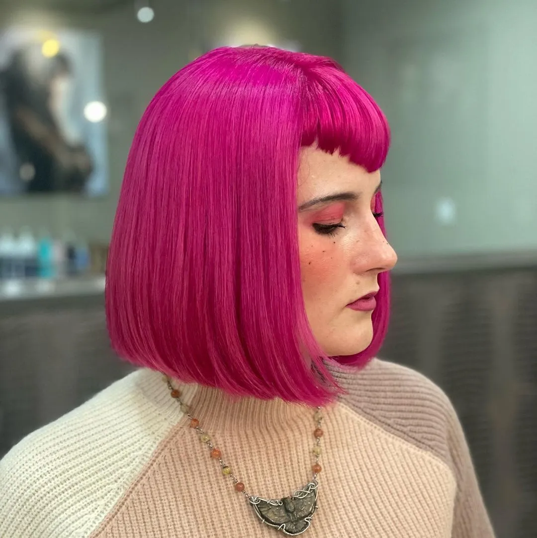 Sleek vivid magenta blunt bob with short fringe