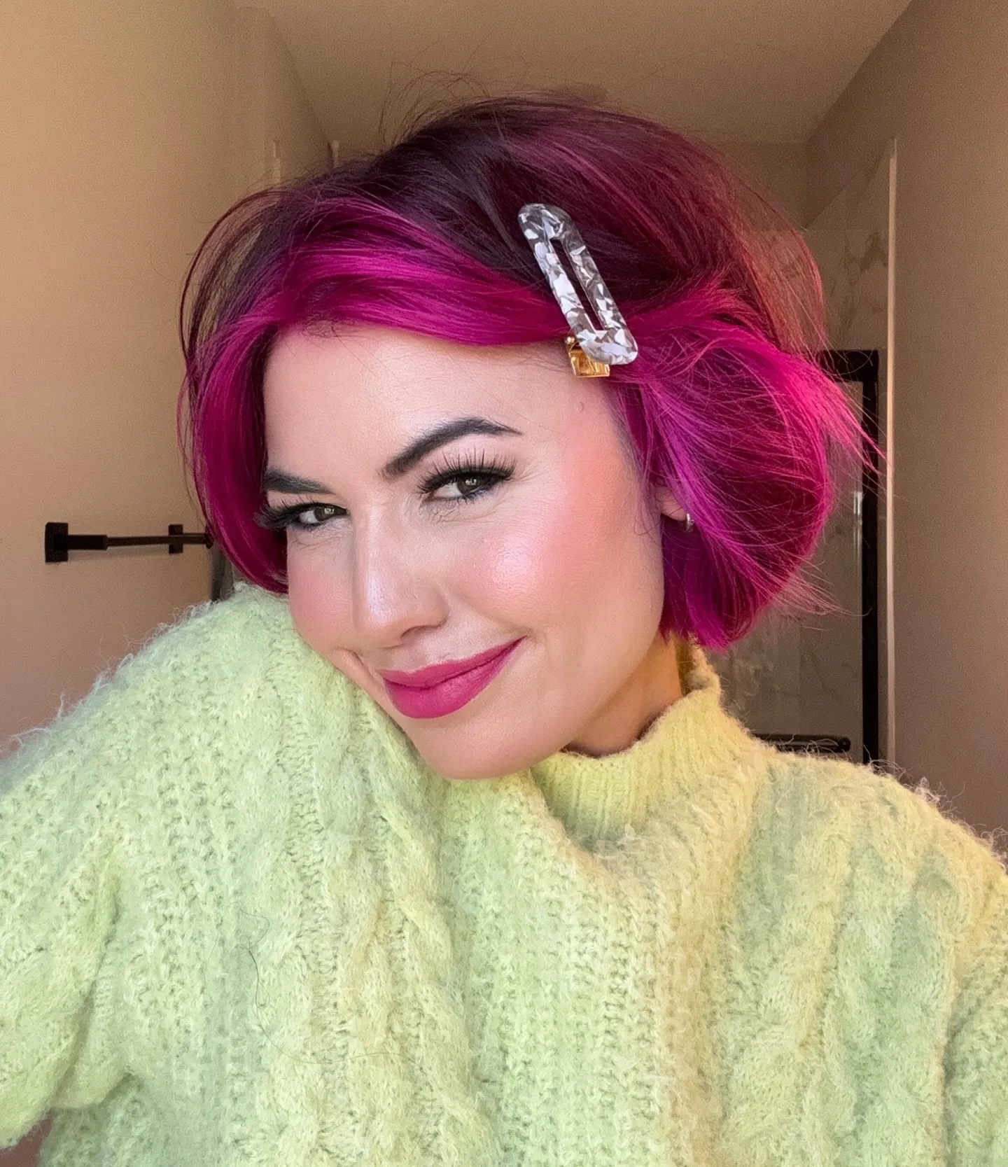 Deep pink side-parted wavy bob with hair clip