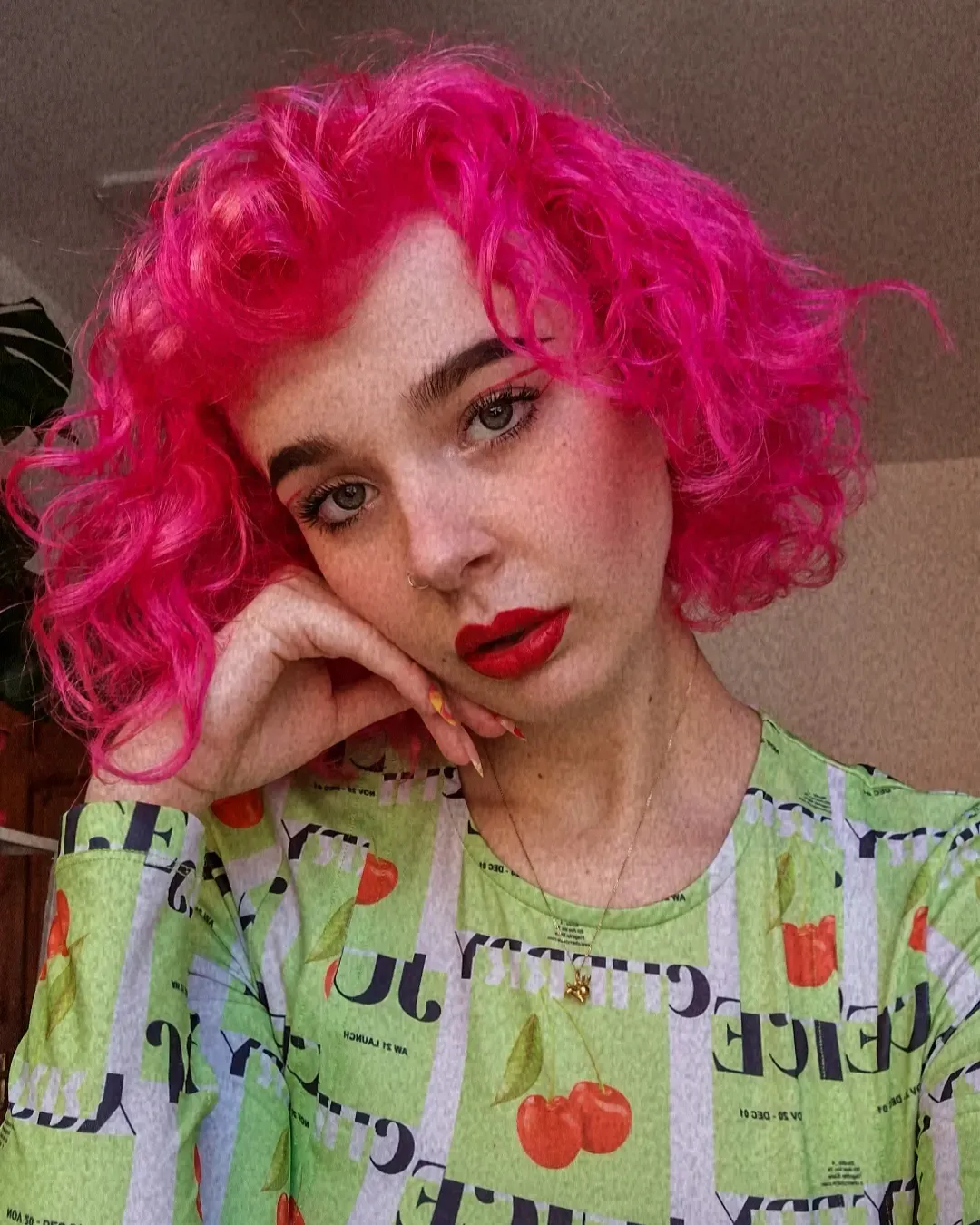 Bright pink curly bob with defined ringlets