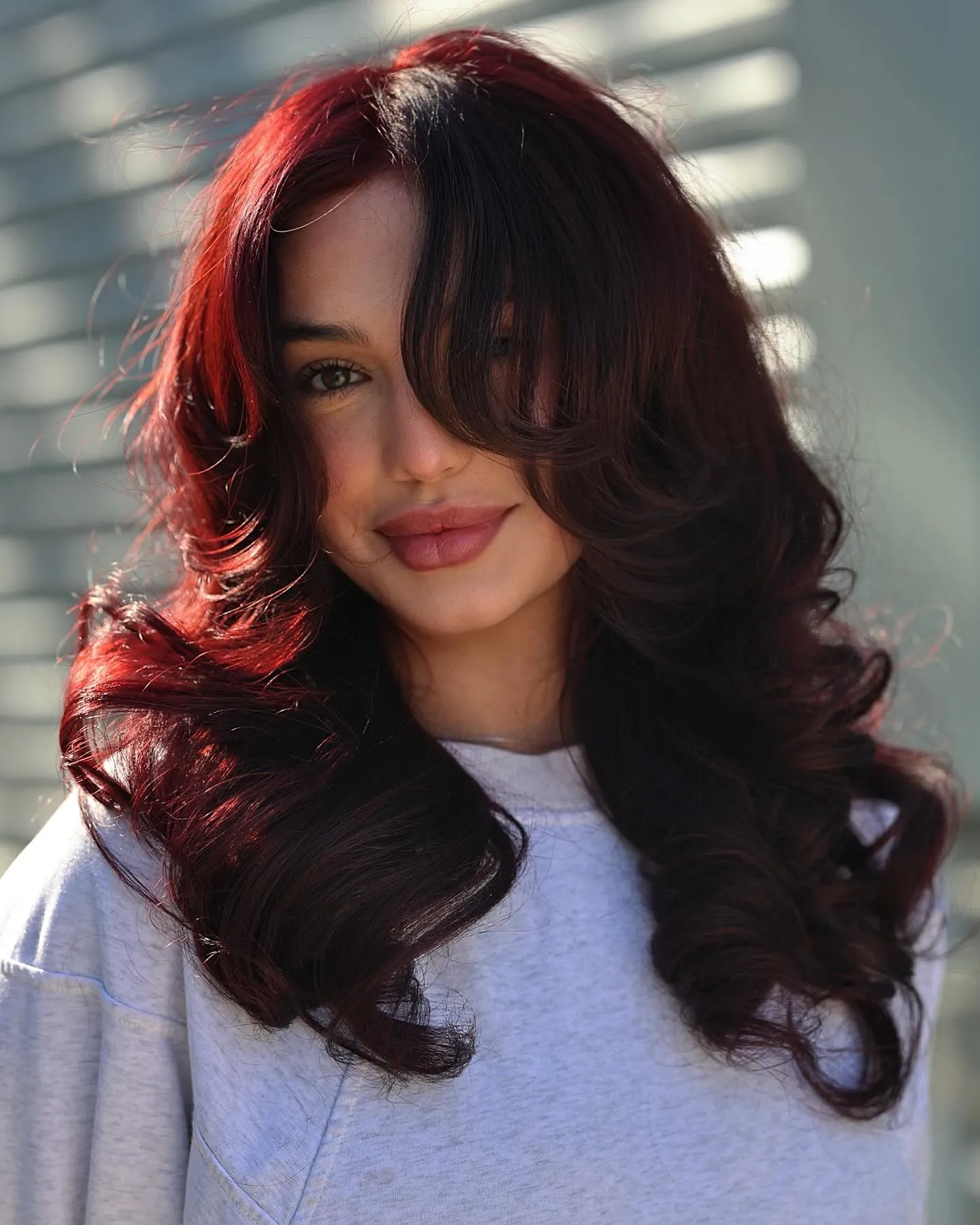 Long dark brown layers with subtle red highlights