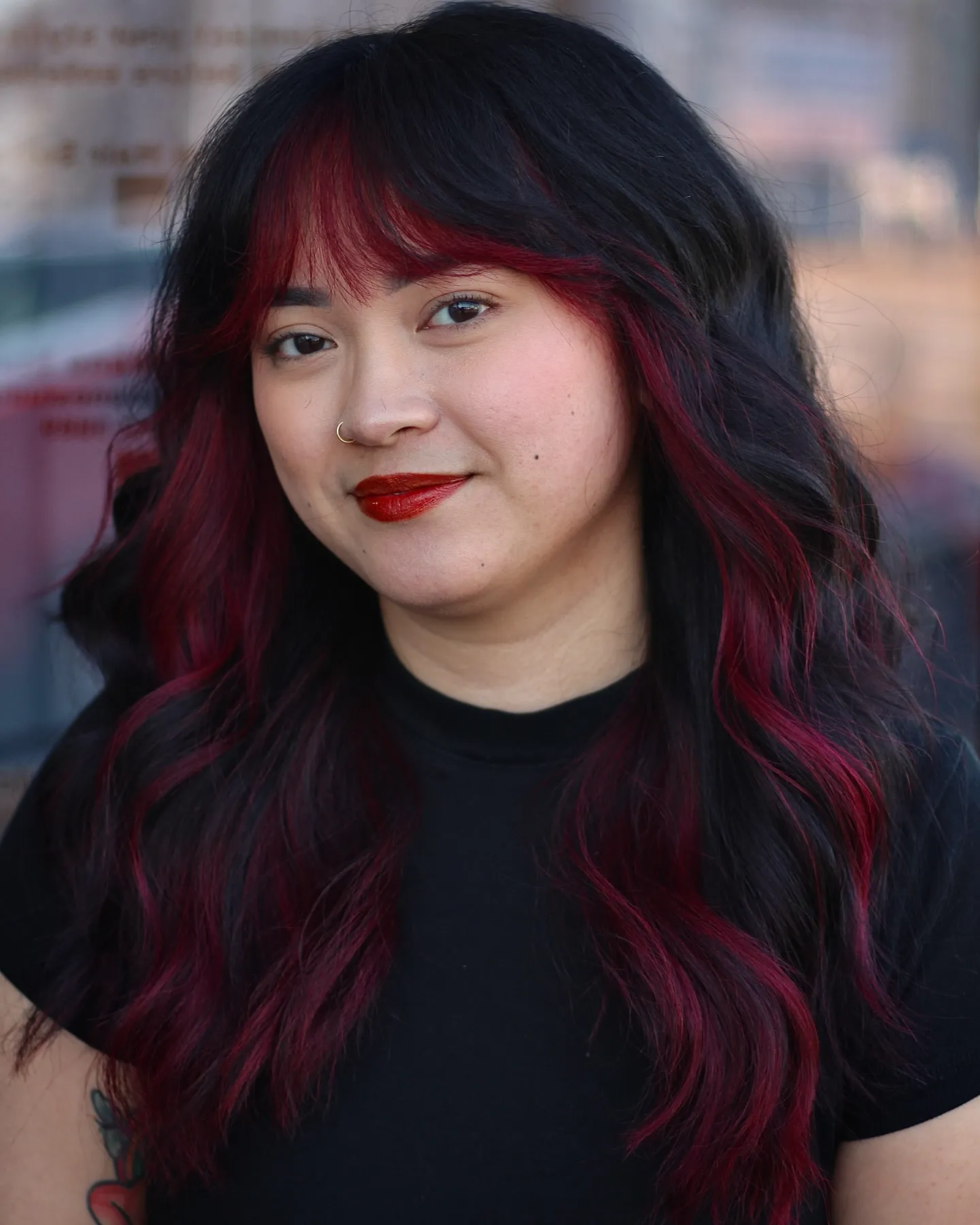 Long black waves with red streaks and a full fringe