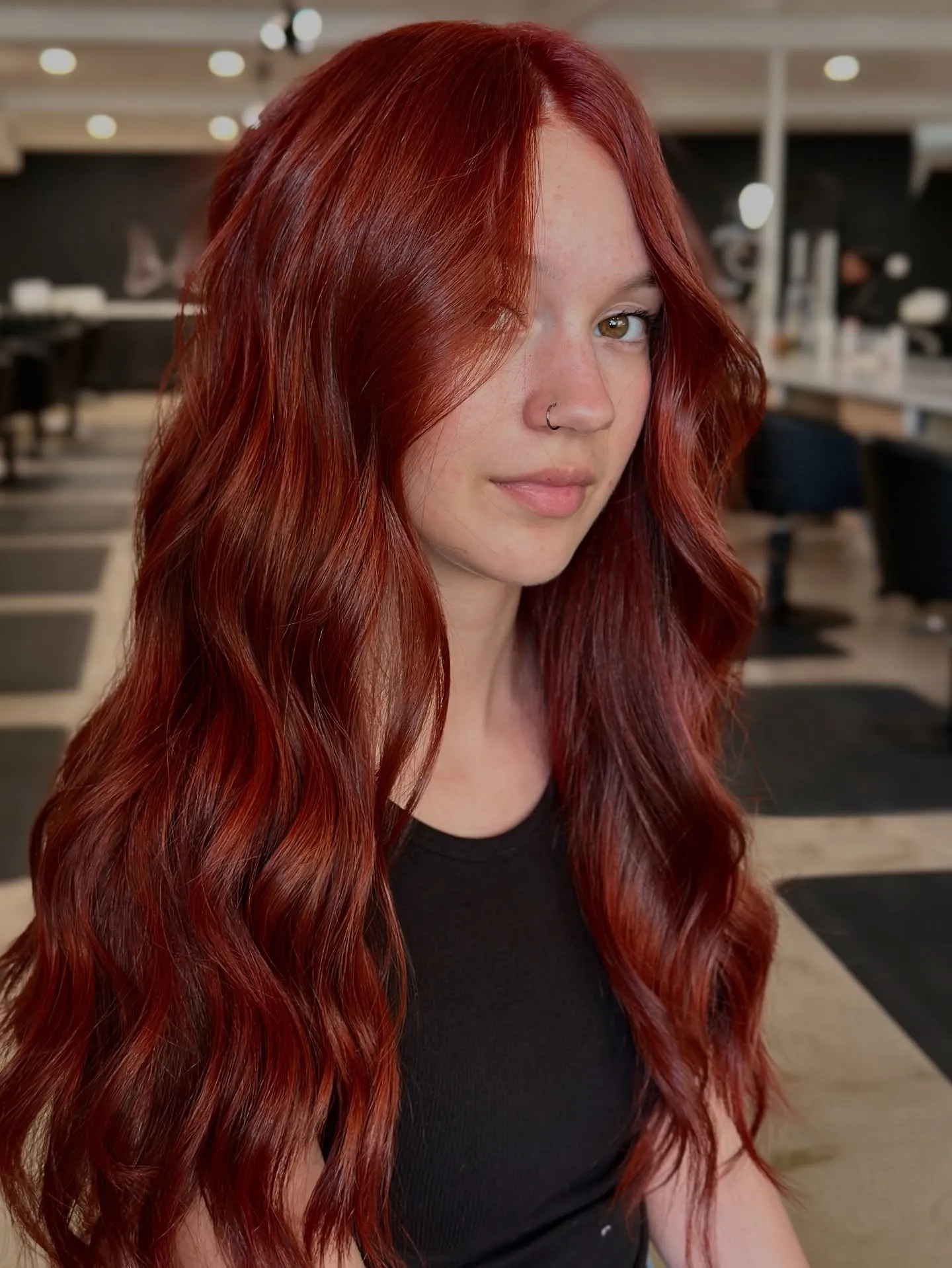 Long copper-red waves with dimensional ribbon highlights