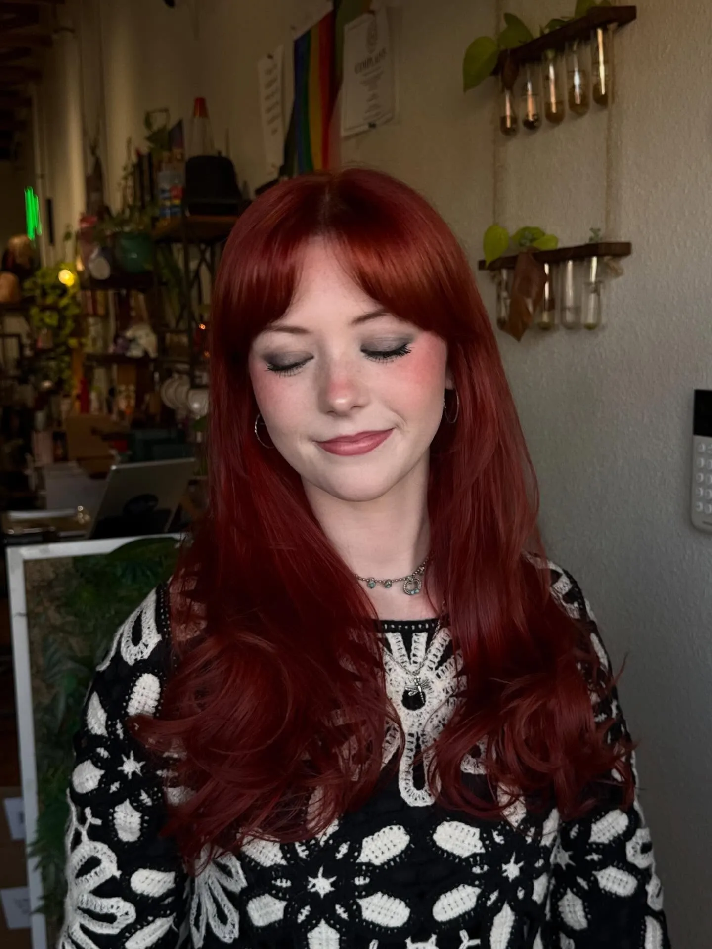 Long auburn-red waves with a full rounded fringe