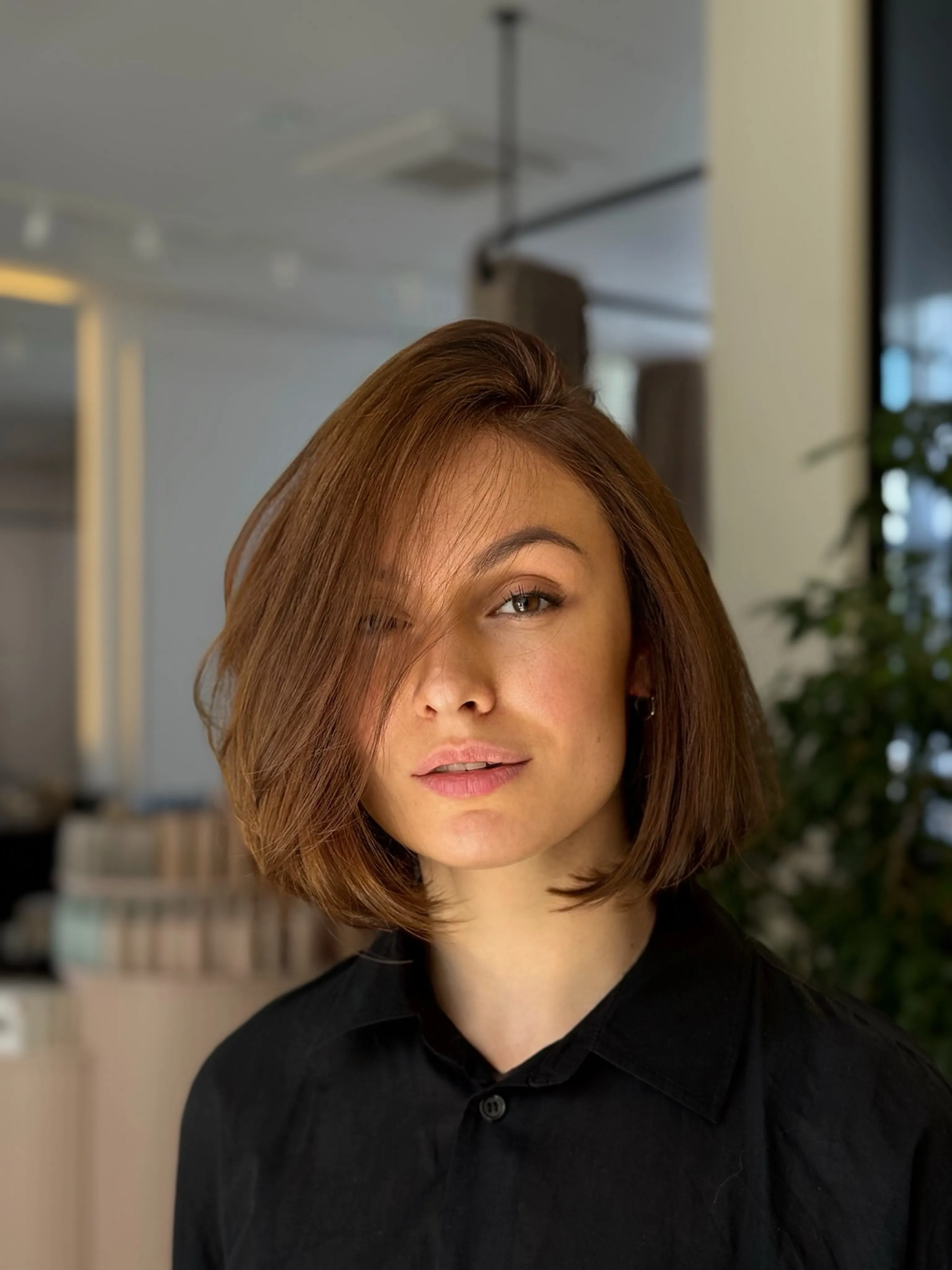 Asymmetrical rounded bob with a deep side part