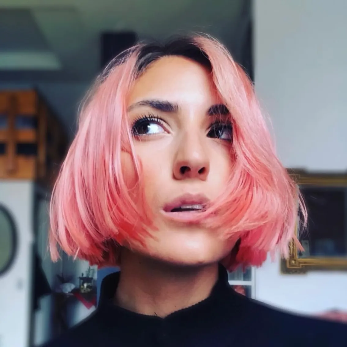 Chin-length rounded bob with a centre part