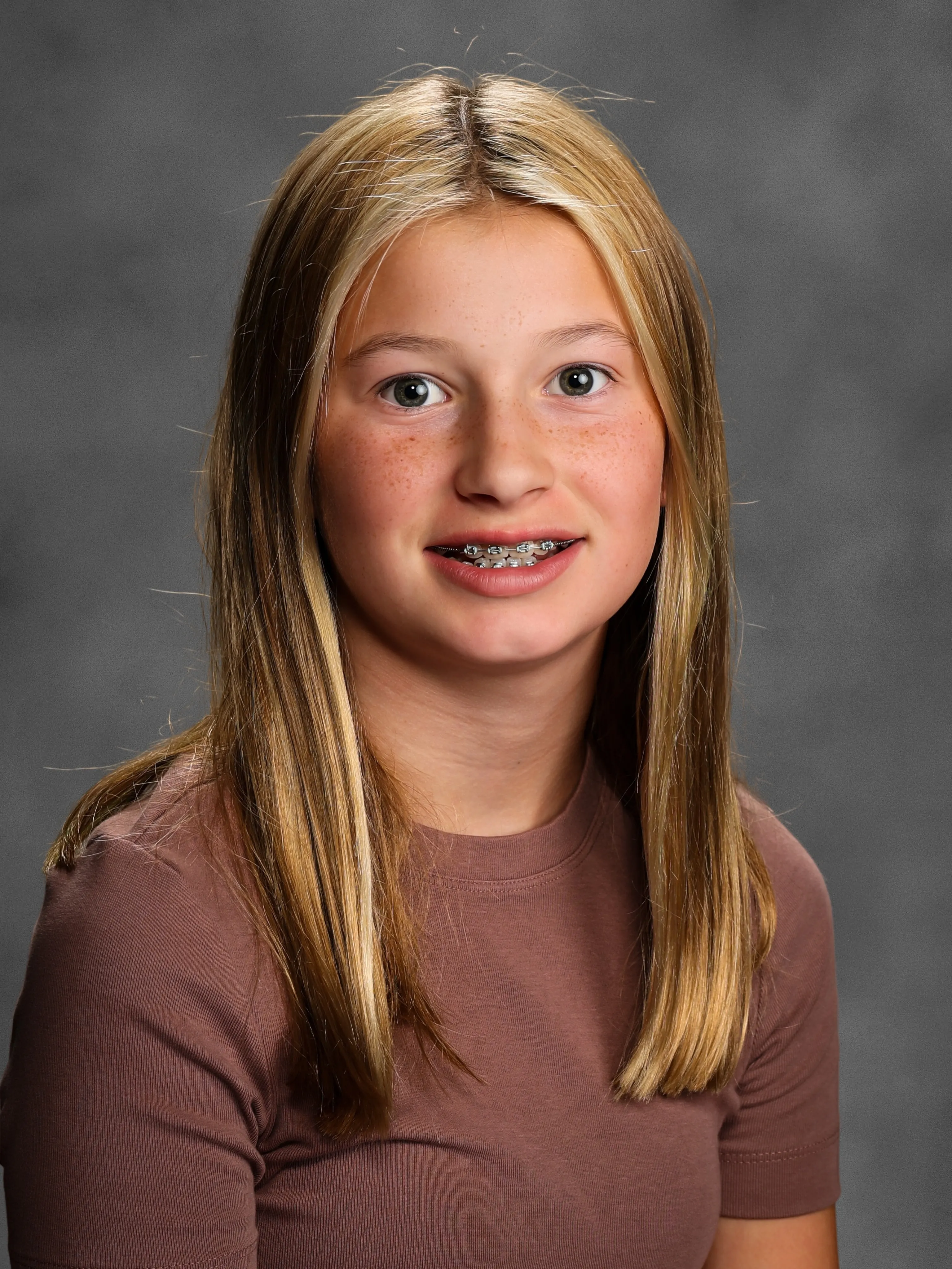 Straight shoulder-length hair with a center part