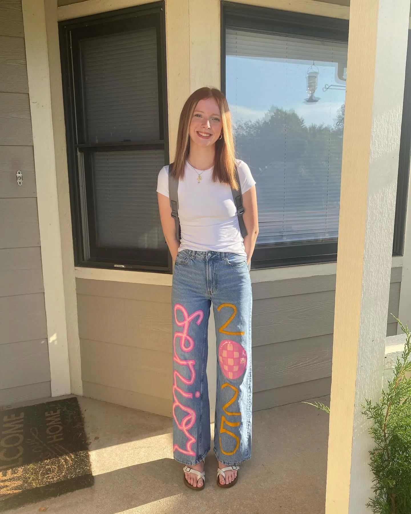 Straight medium hair with a clean middle part