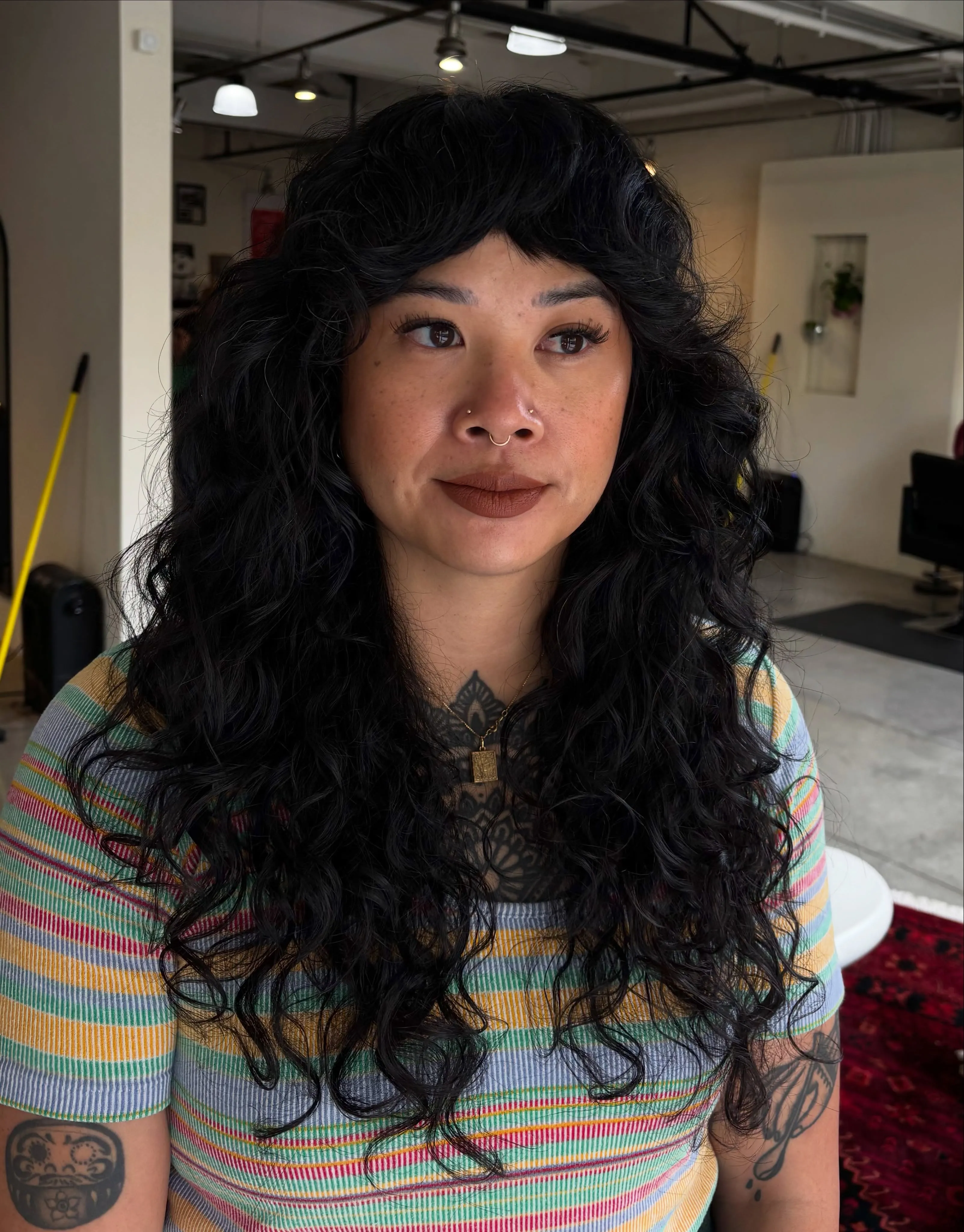 Long curly shag with full fringe and cascading layered curls