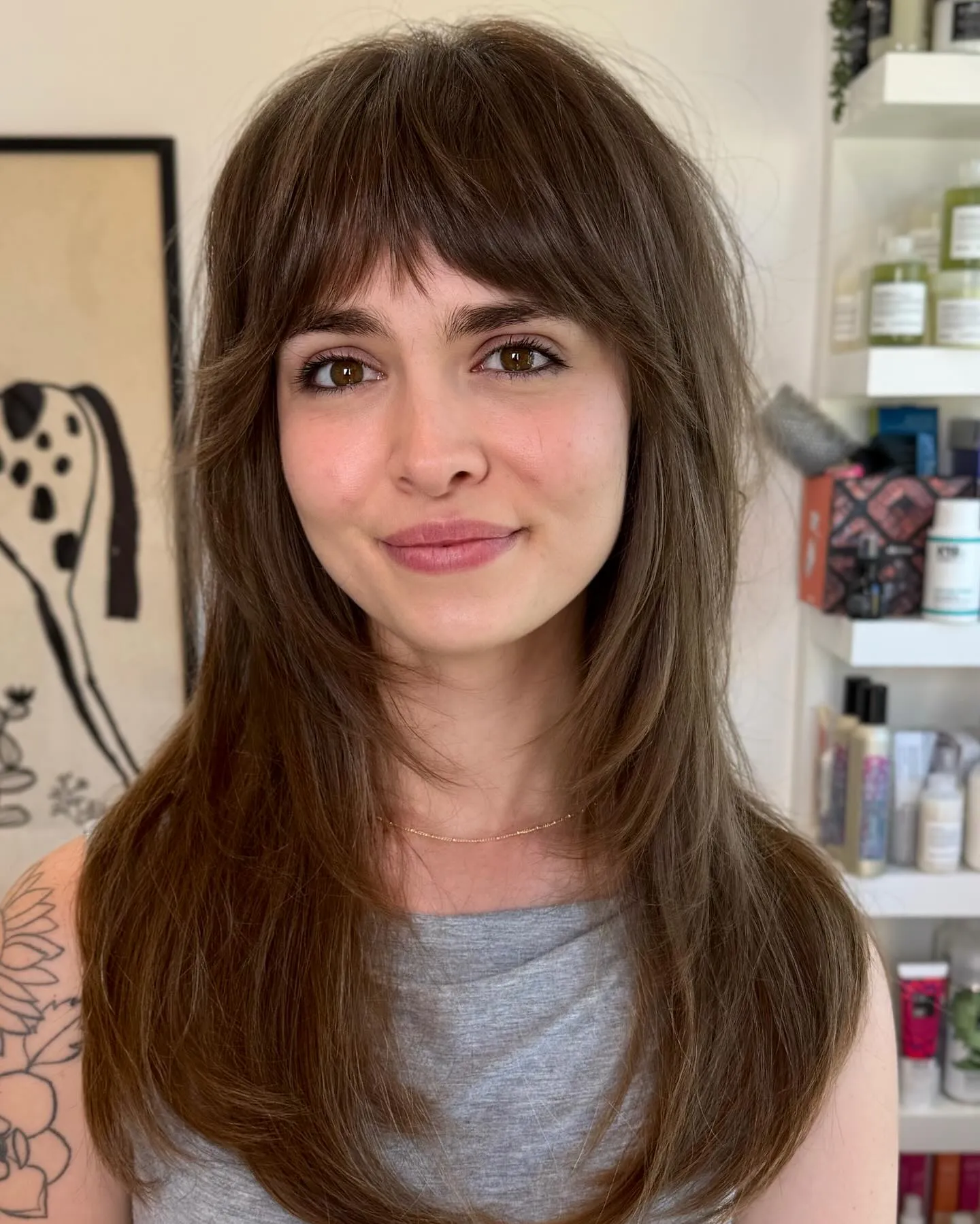 Long layered shag with soft full fringe and smooth face-framing pieces