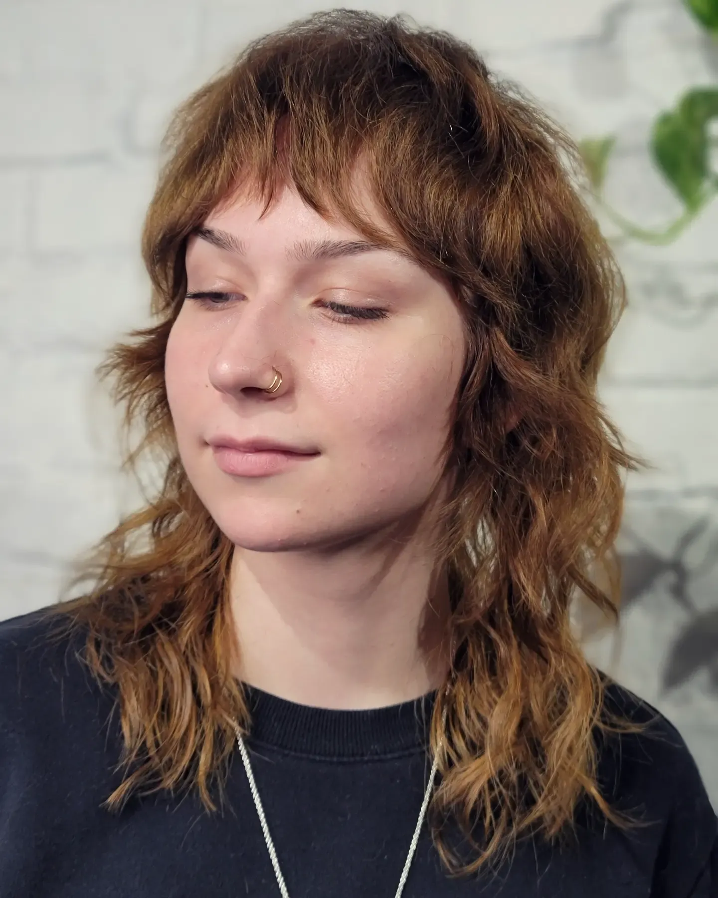Choppy shag mullet with baby fringe and textured shoulder-length ends
