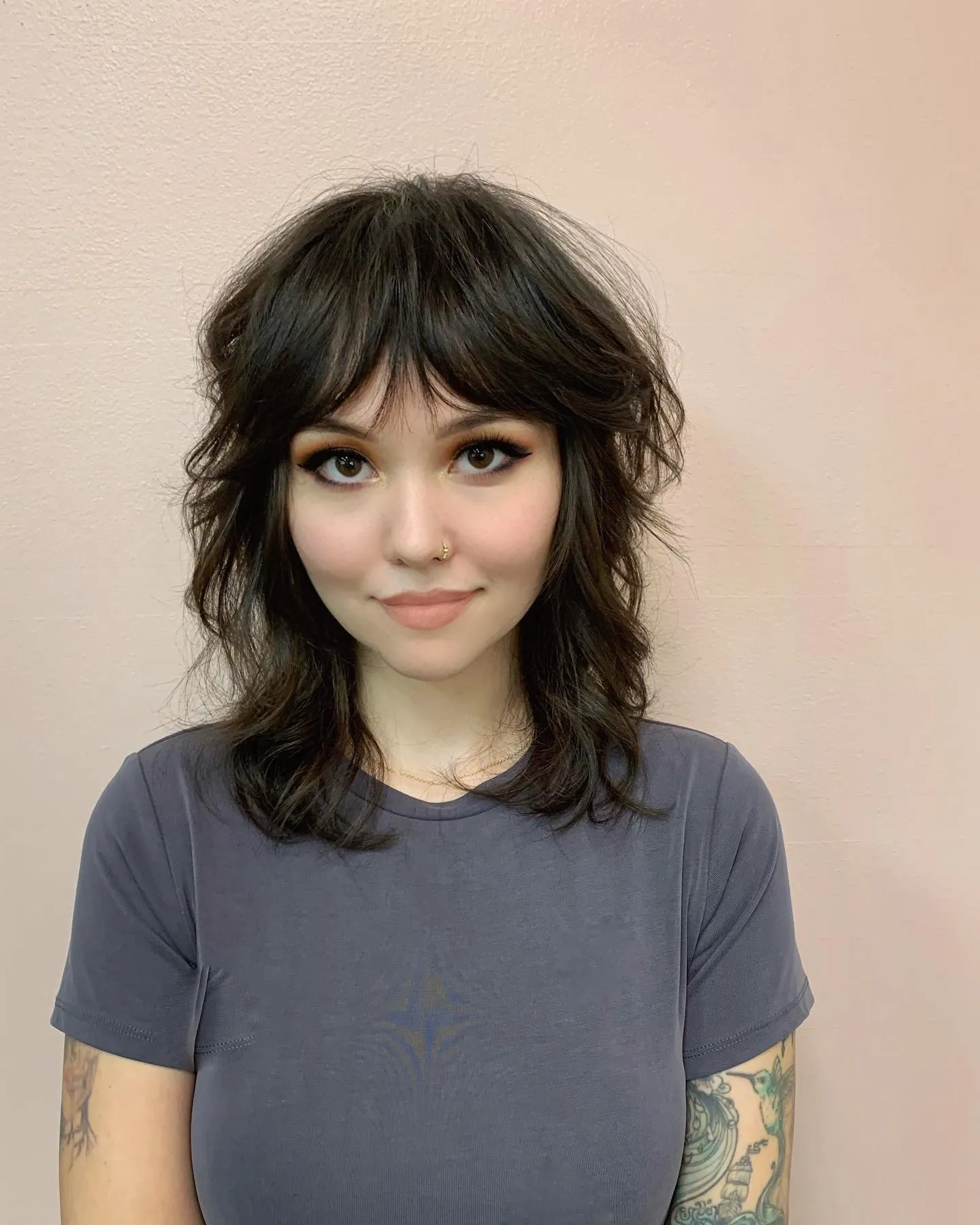 Shoulder-length shag with curtain fringe and loose textured layers