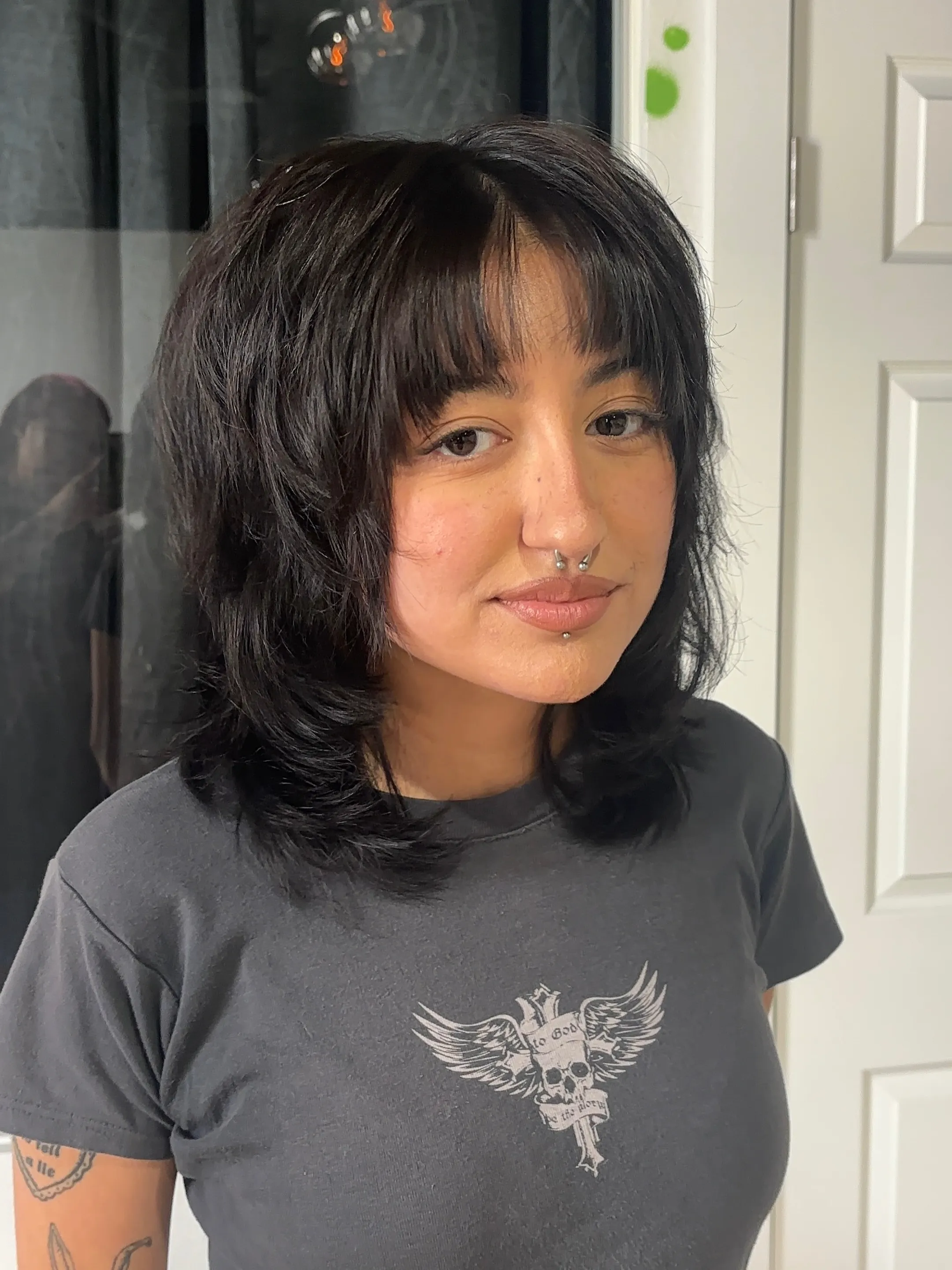 Soft black shag with airy fringe and shoulder-skimming layers
