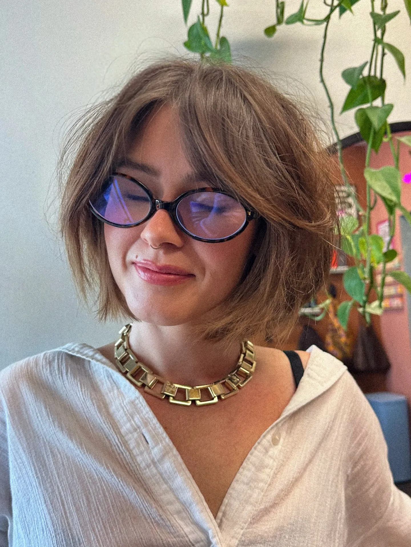 Tousled layered short bob with long curtain bangs and textured jaw-length ends