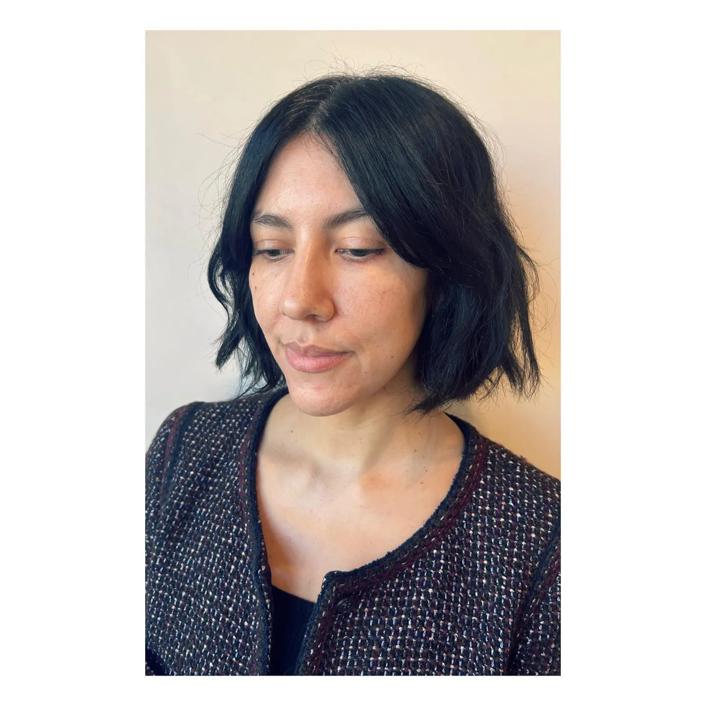 Centre-parted wavy short bob with long curtain bangs and piecey ends