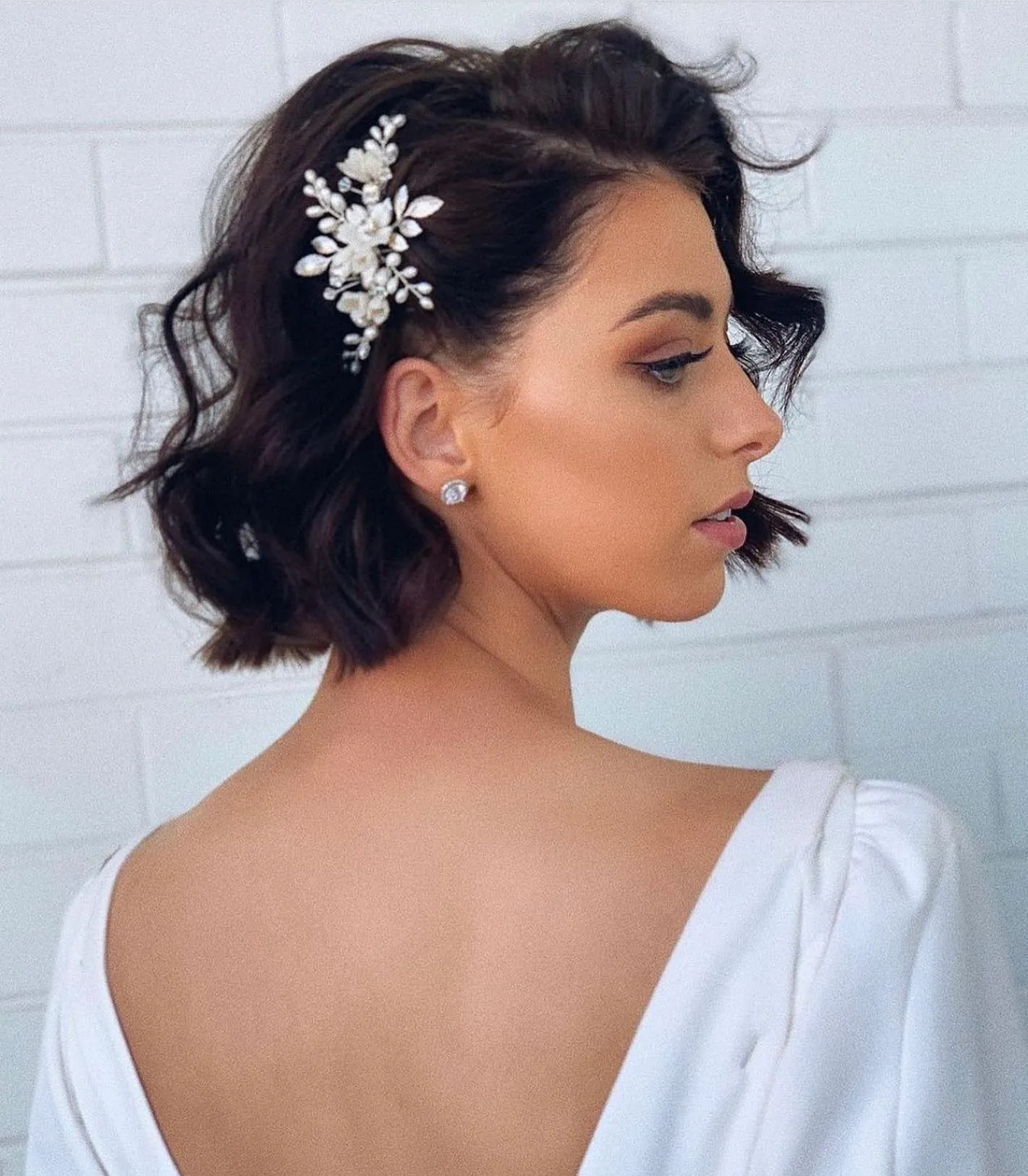 side-swept wavy bridal bob with crystal comb