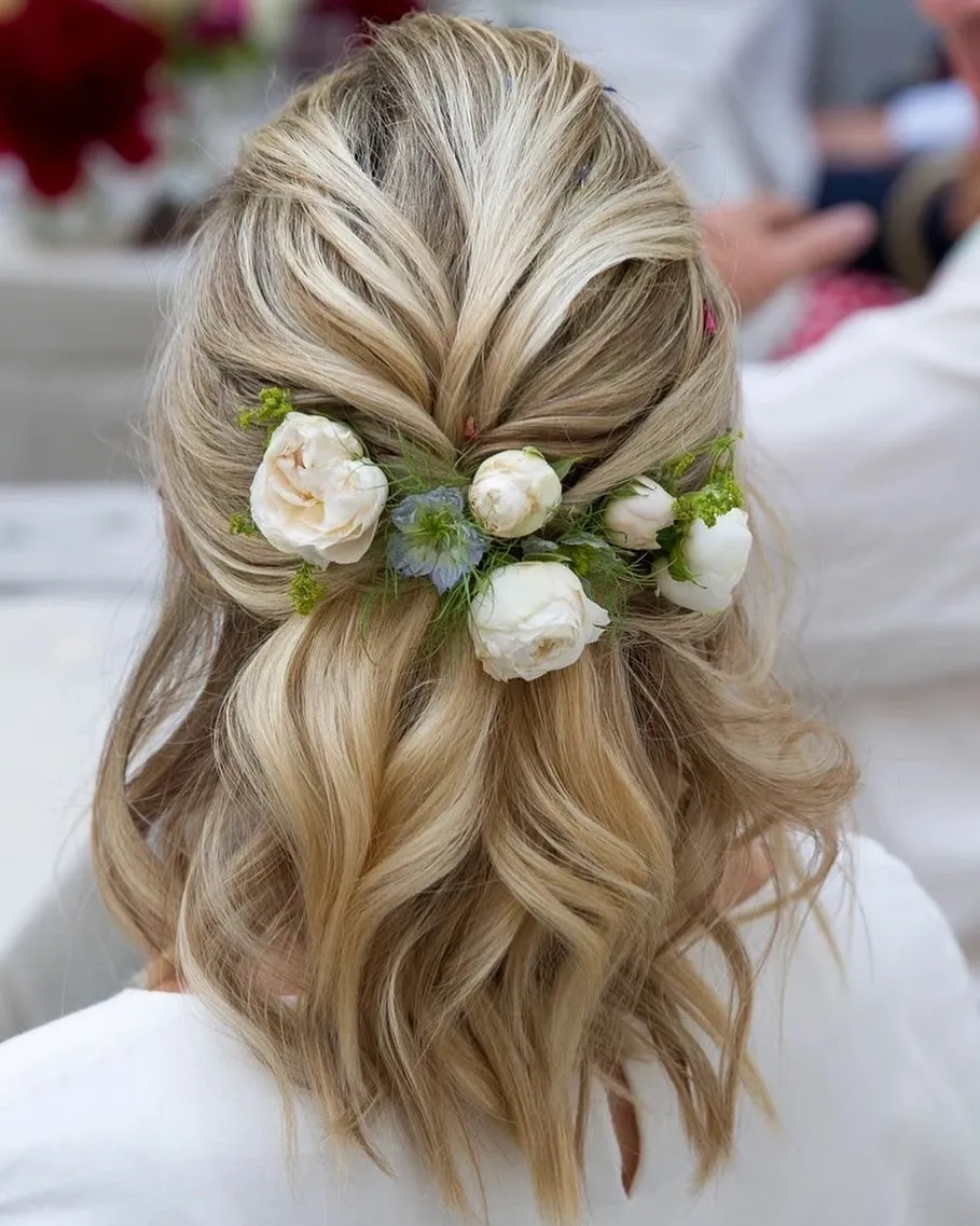 half-up blonde bridal bob with white roses and greenery