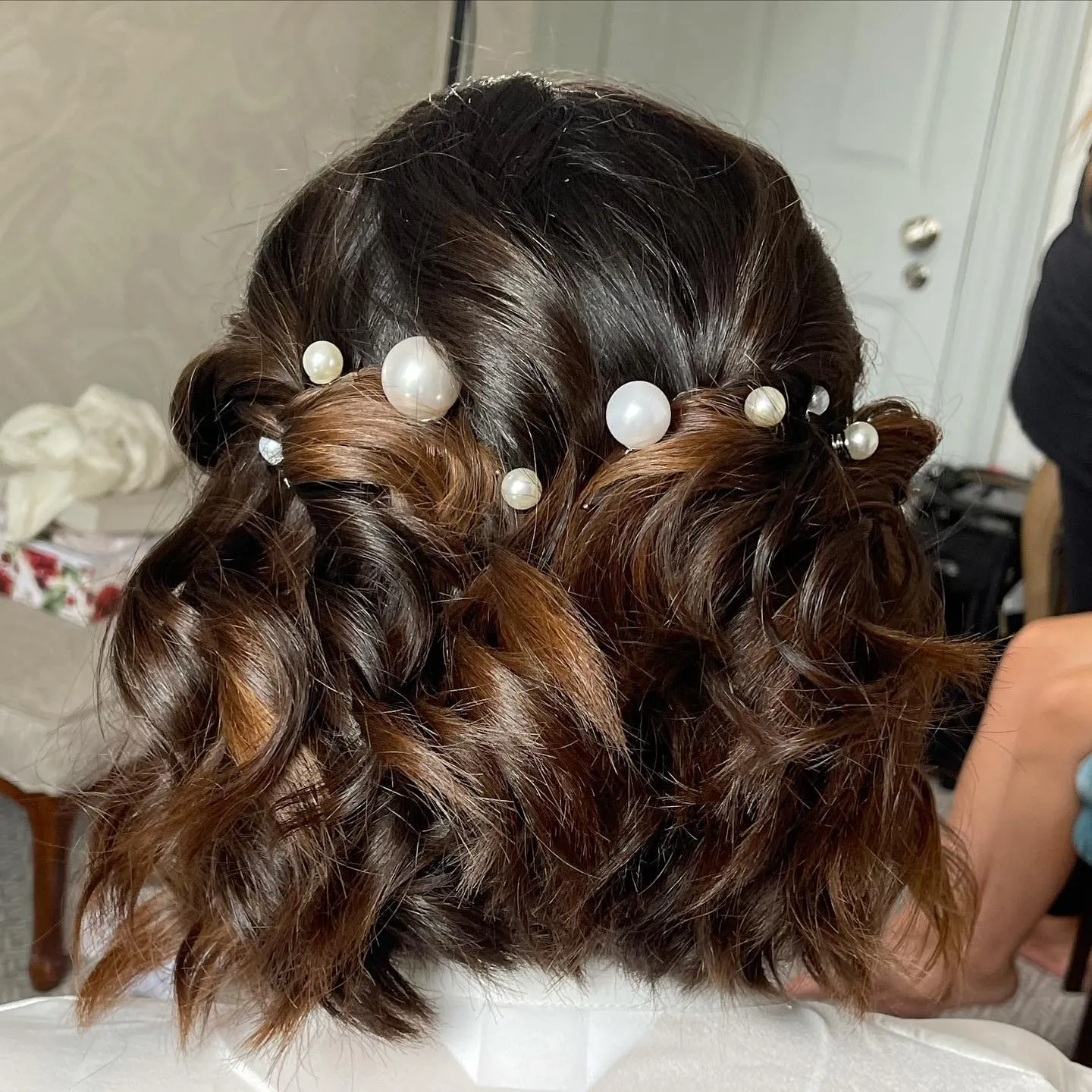 twisted brunette bridal bob with pearl pins