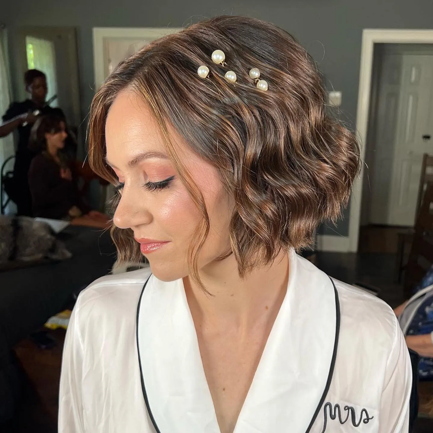 polished short bridal bob with scattered pearl pins
