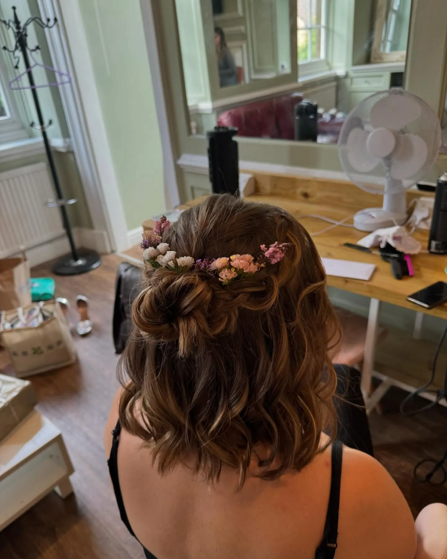 half-up short bridal lob with pink flower crown