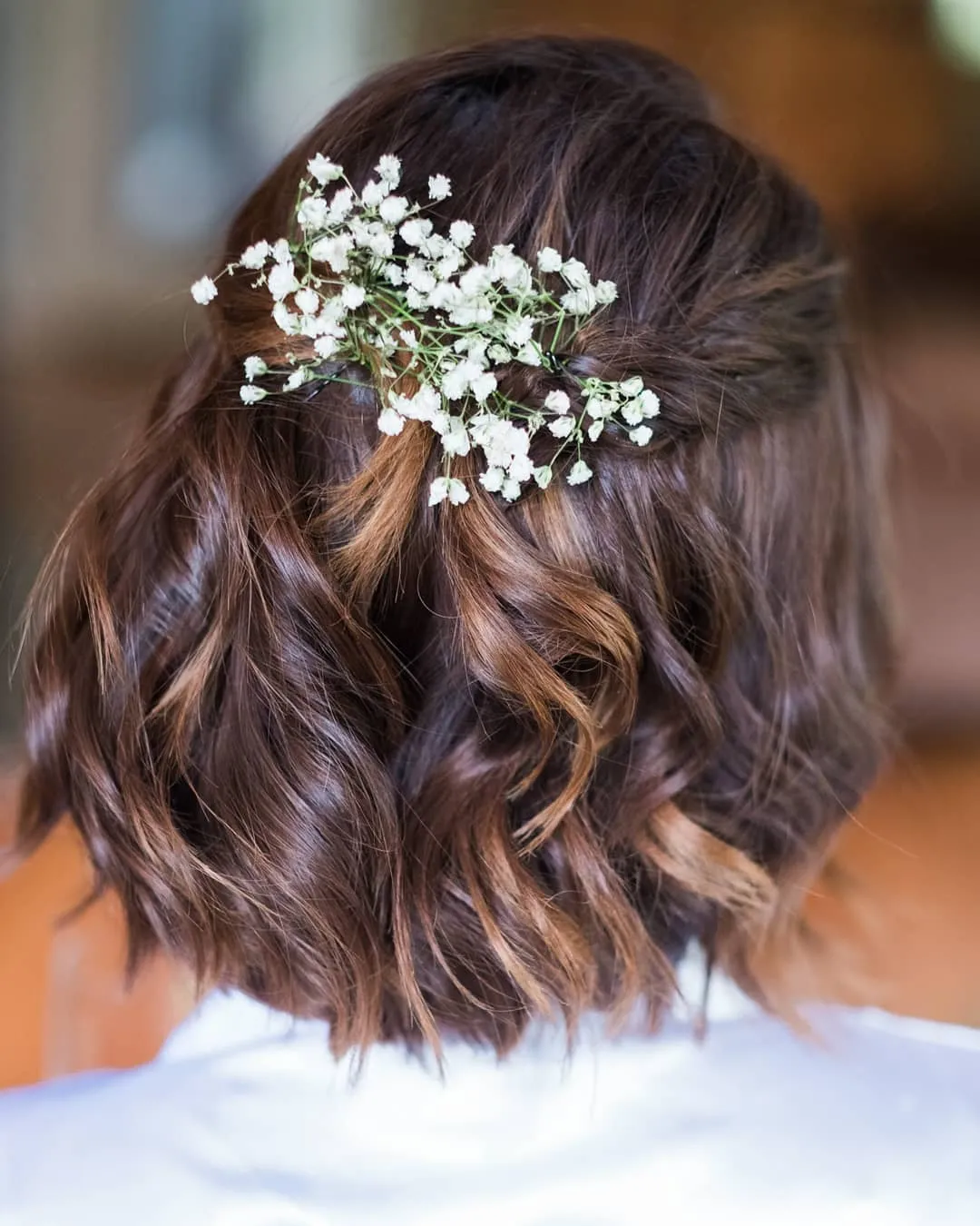 curled bridal bob with baby's breath cluster