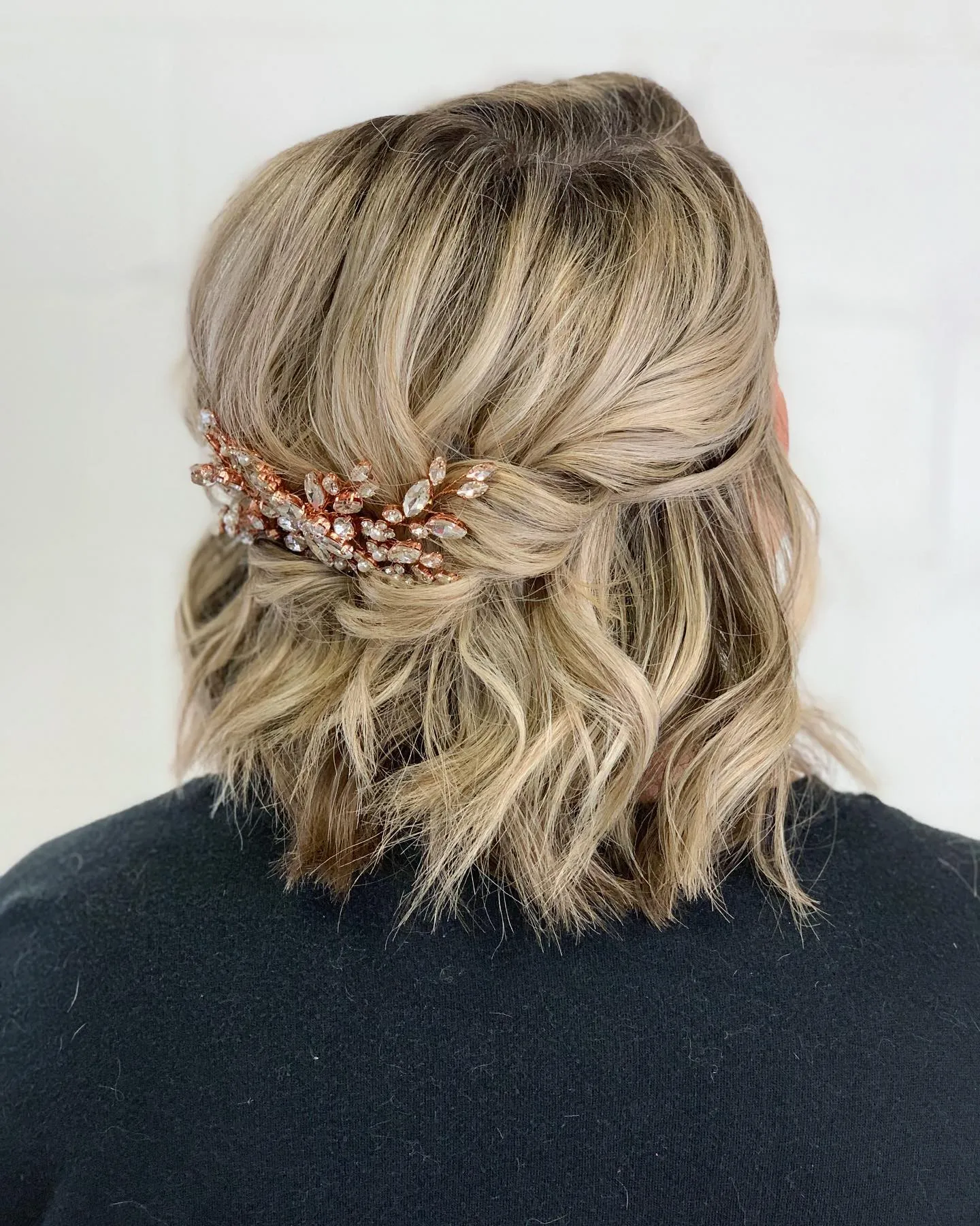 wavy blonde bridal bob with rose-gold hair vine