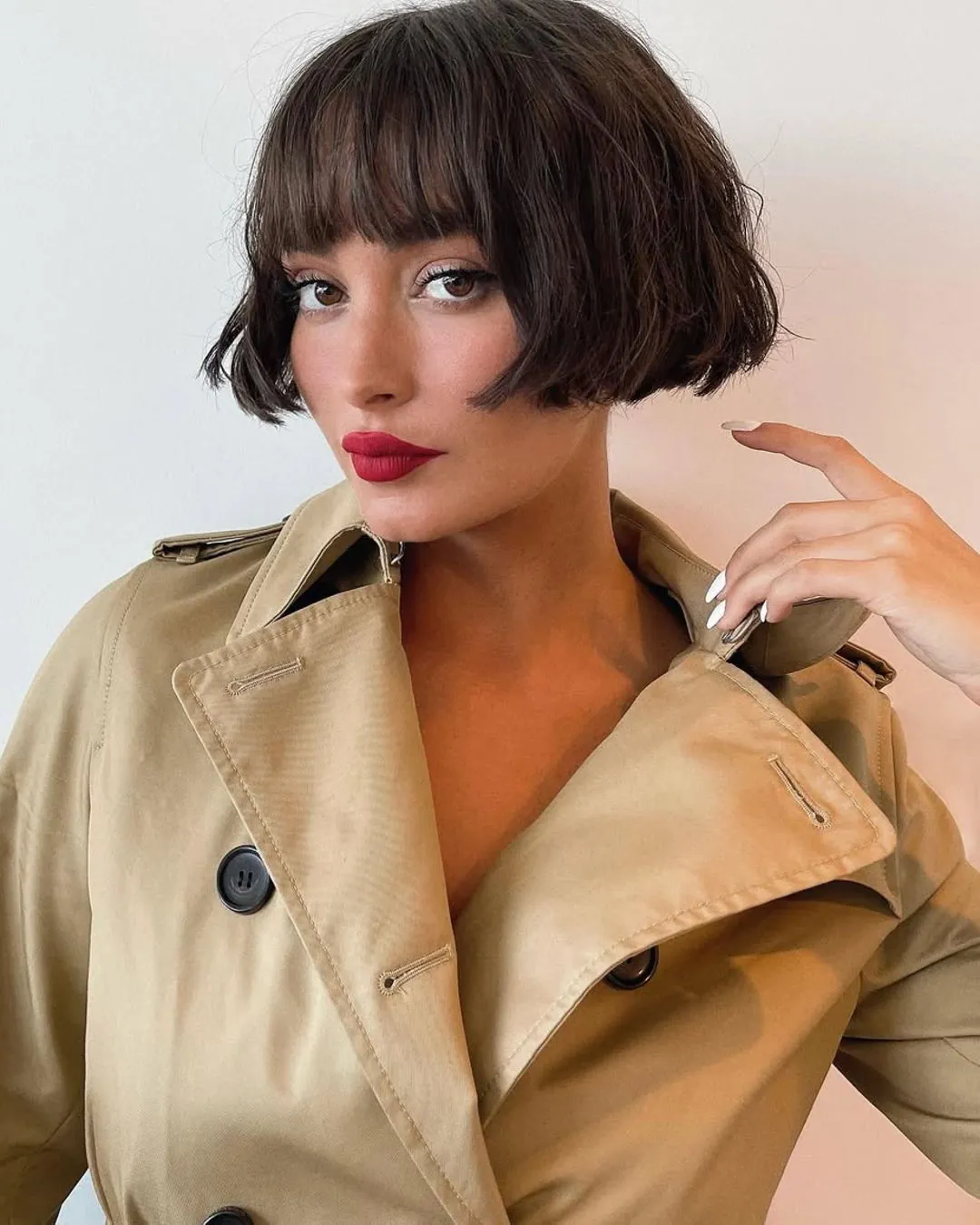 Blunt dark bob with full straight bangs