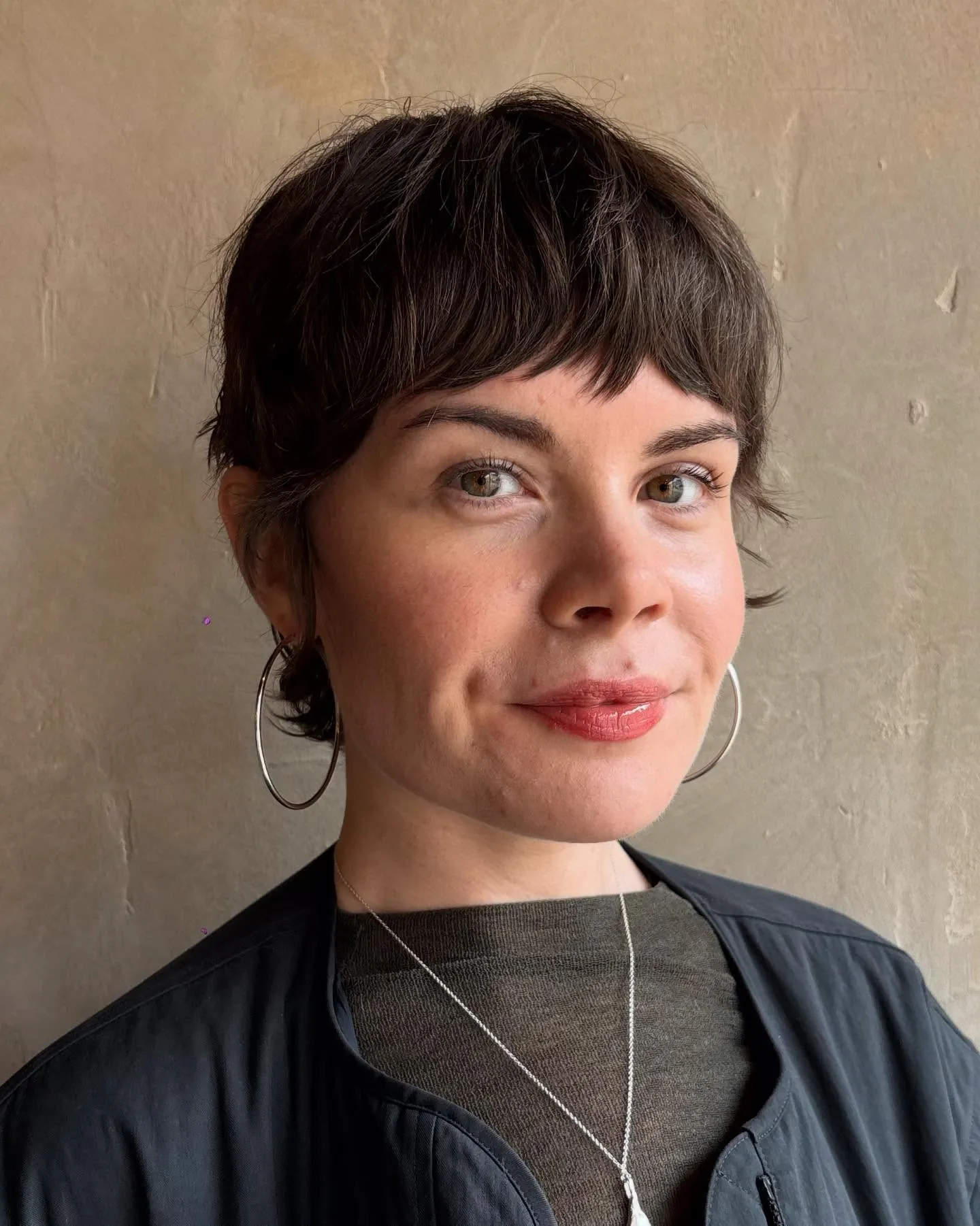 Textured dark pixie with short fringe