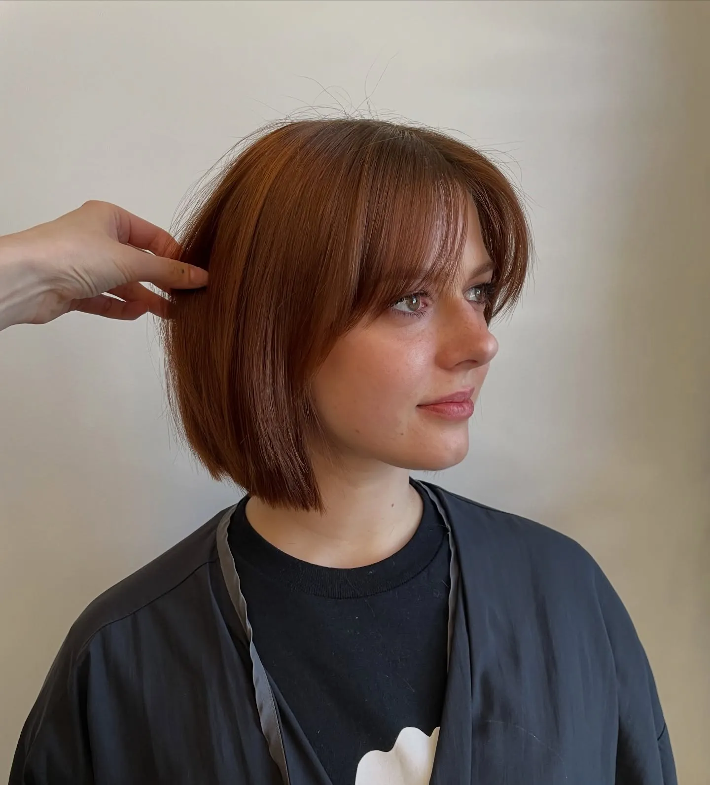 Auburn short bob with straight curtain fringe