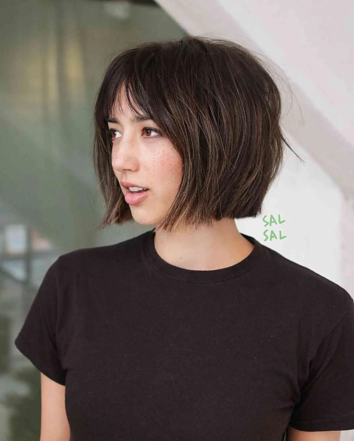 Dark short bob with wispy bangs and piecey ends