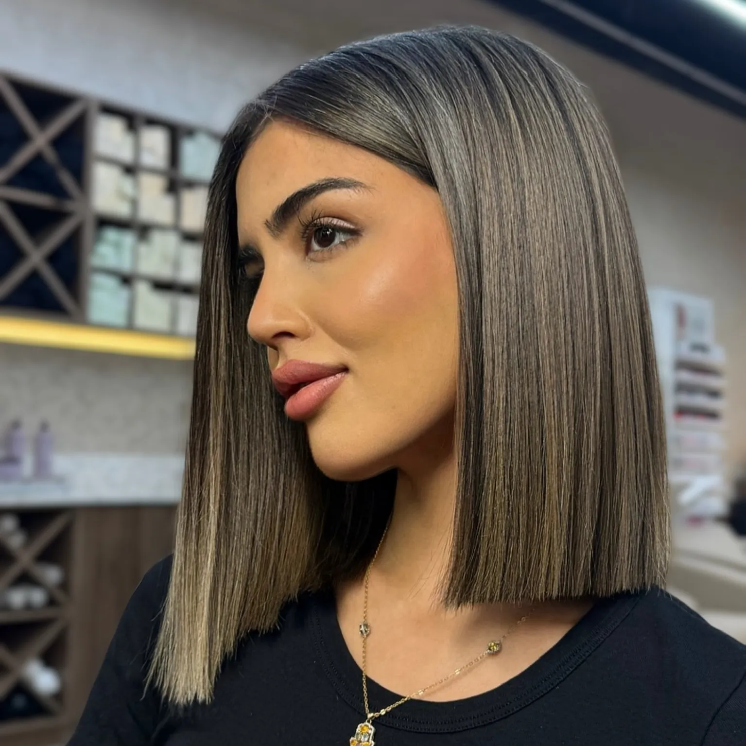 Sleek straight lob with a deep side part