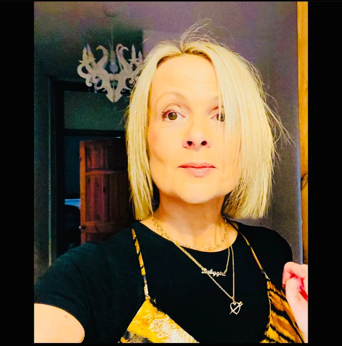 Choppy blonde chin-length bob with a relaxed centre part