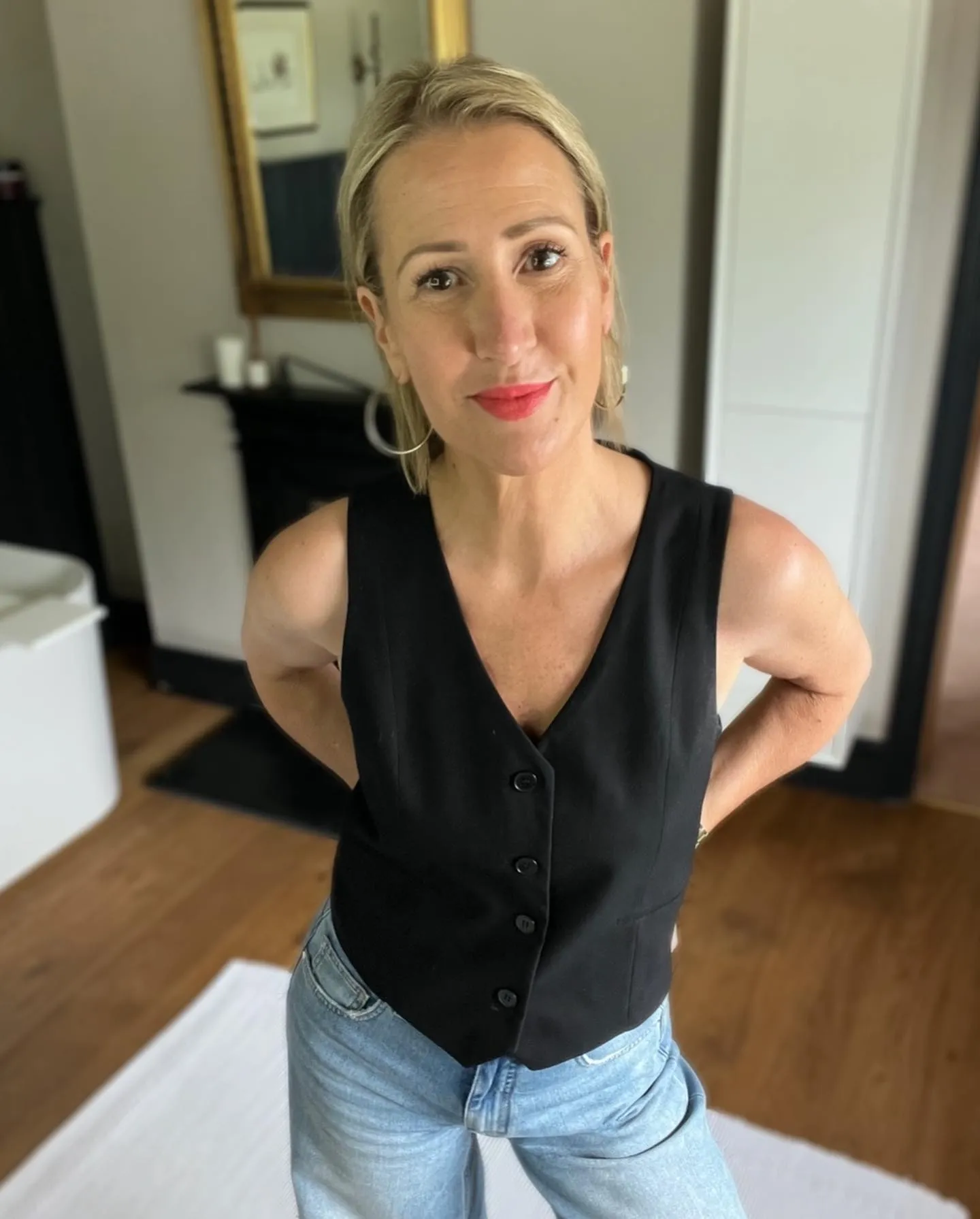 Short blonde pixie crop swept neatly away from the face