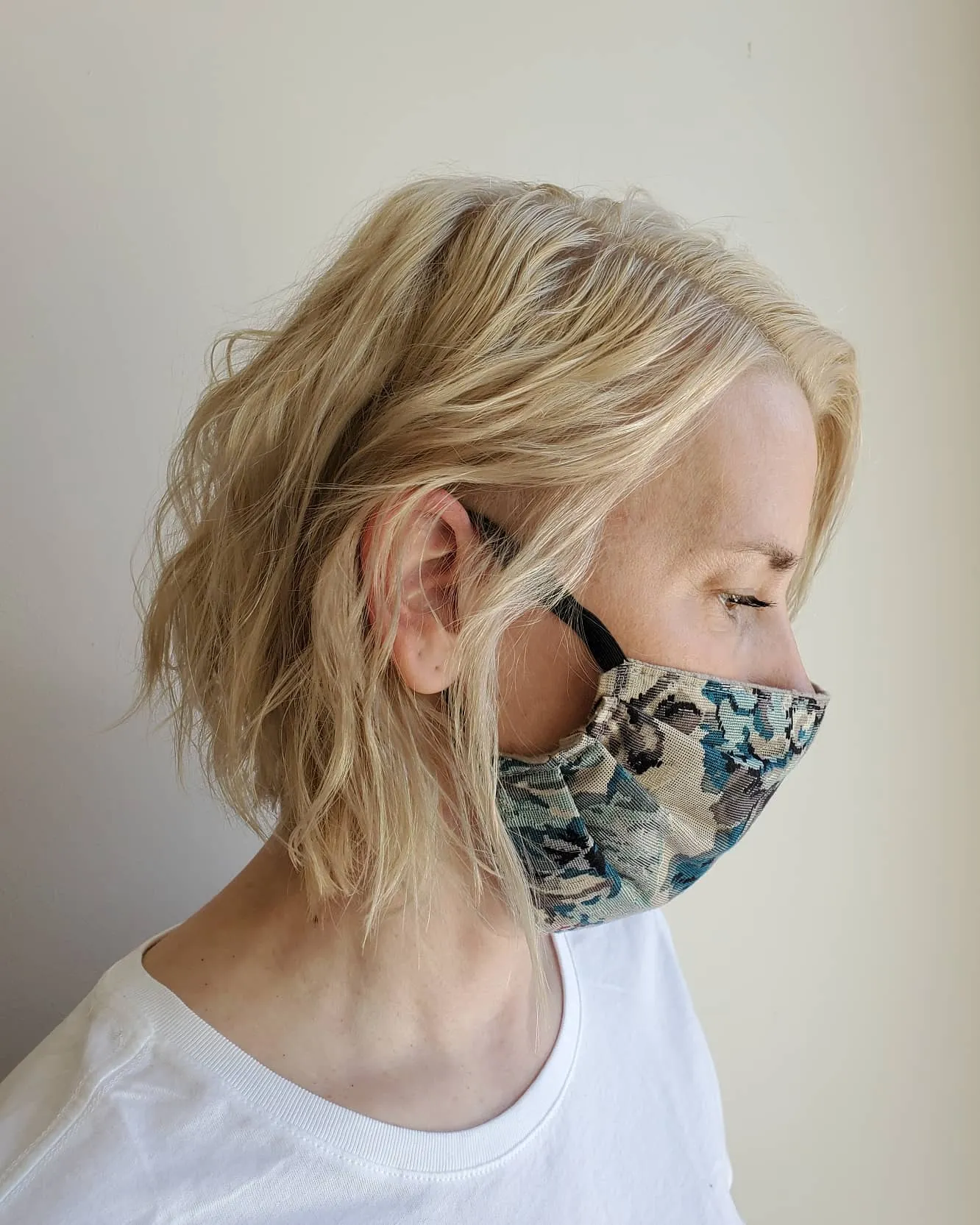 Tousled blonde bixie cut with loose waves and textured layers