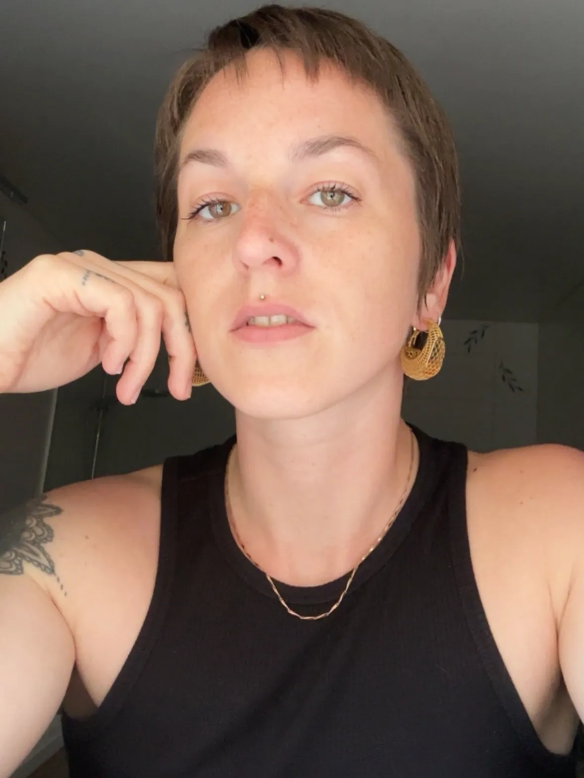 Very short micro pixie cut with softly textured top