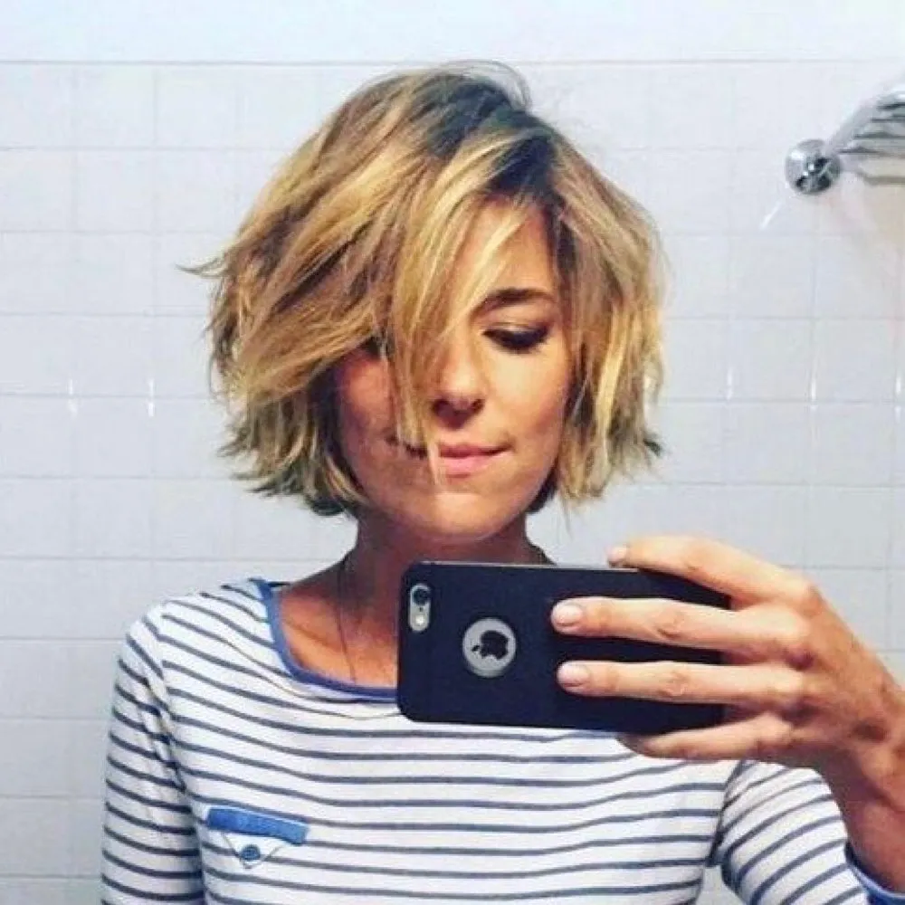 Tousled chin-length bob with choppy layers and side fringe