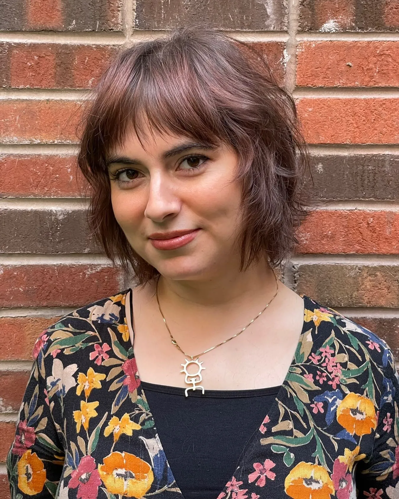 Jaw-length shaggy bob with full fringe and softly flicked textured ends
