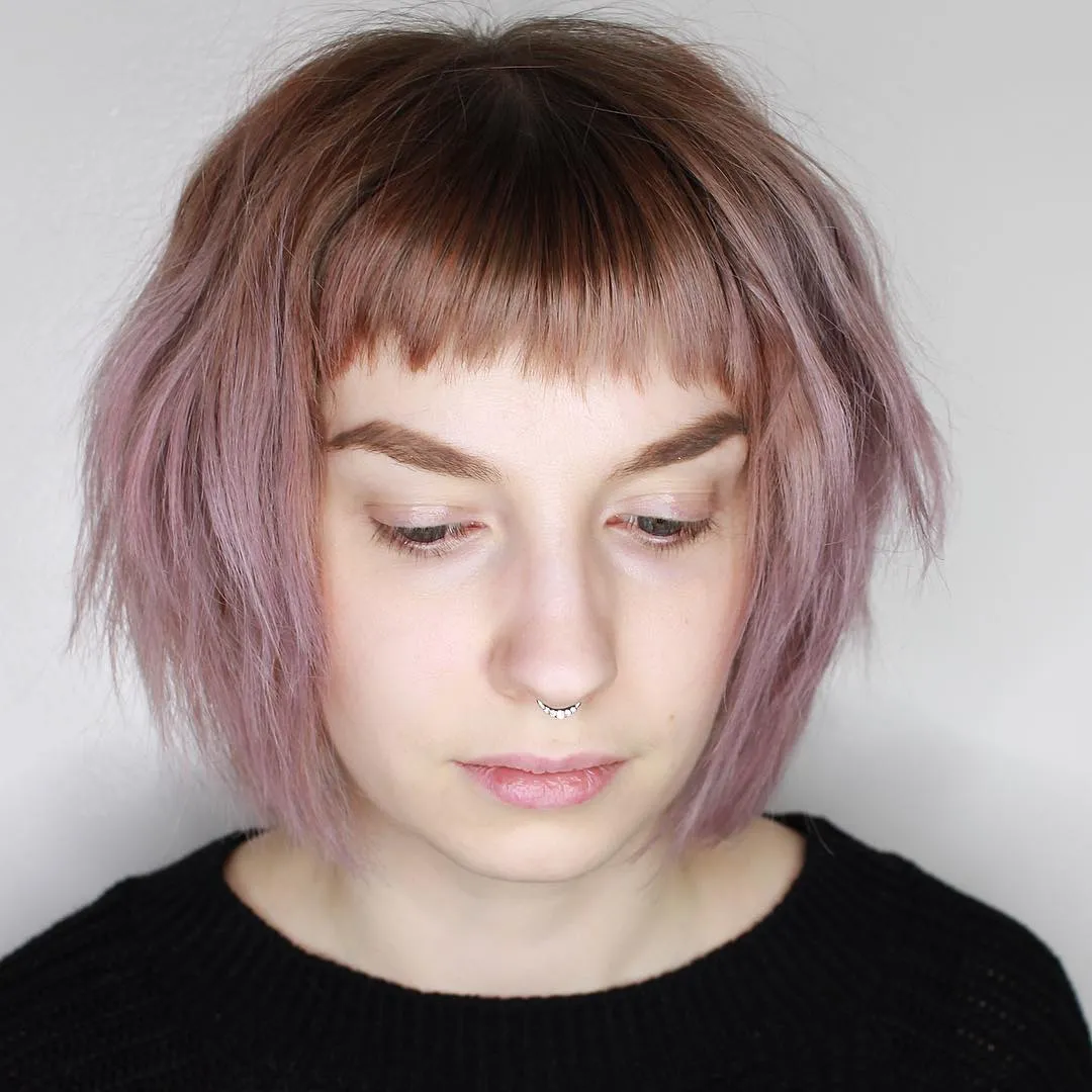 Blunt shaggy bob with micro fringe and softly textured chin-length ends