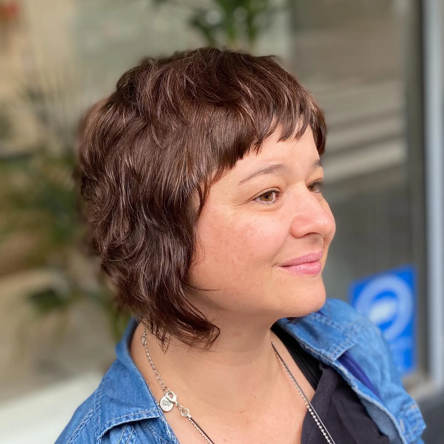 Short mullet bob with micro fringe and choppy textured nape layers